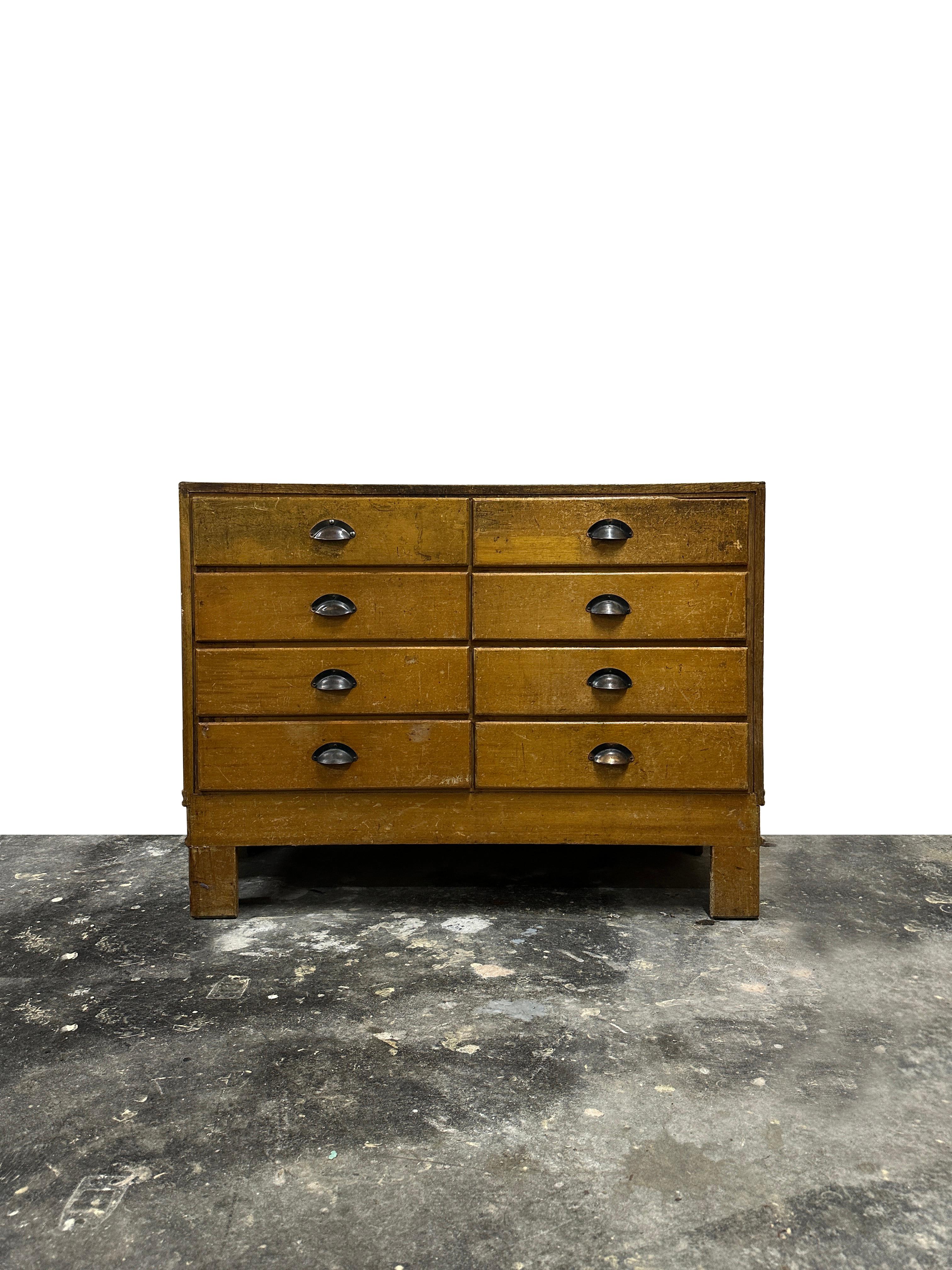- A beautifully presented glazed haberdashery shop counter of smaller proportion, England circa 1940.
- Glass top and sides over a flight of eight graduated oak fronted drawers and with original brass handles, ideal for a bedroom, hallway or living