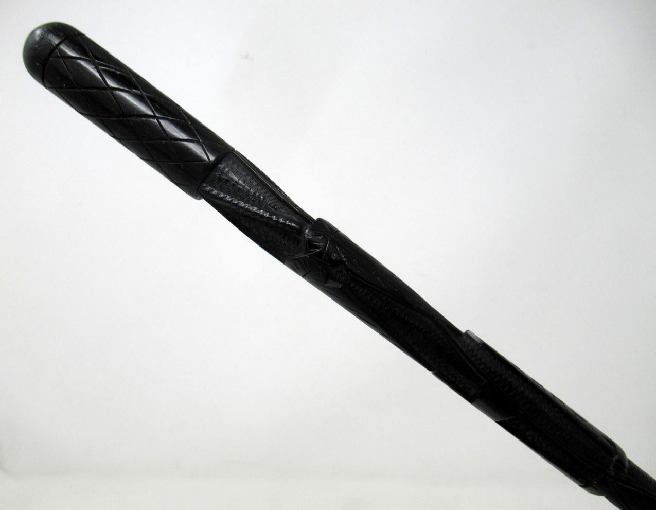 Stylish hand carved Irish Bog oak lady’s or gentleman’s swagger stick, mid-late 19th century. 

The unusually long grip finely carved depicting Shamrocks, Vine Leaves, a Round Tower, a Crucifix and Laurel leaves. 

Condition: Superb condition