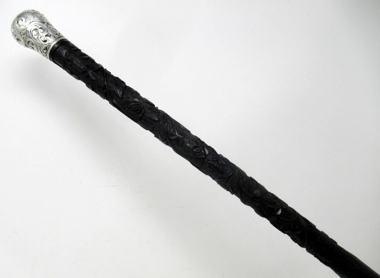 An exceptionally fine quality late nineteenth century stylish hand carved irish bog oak lady’s or gentleman’s walking stick.

The unusual Sterling Silver decorative grip above a carved shaft depicting Irish Shamrocks, a Scottish Thistle and an
