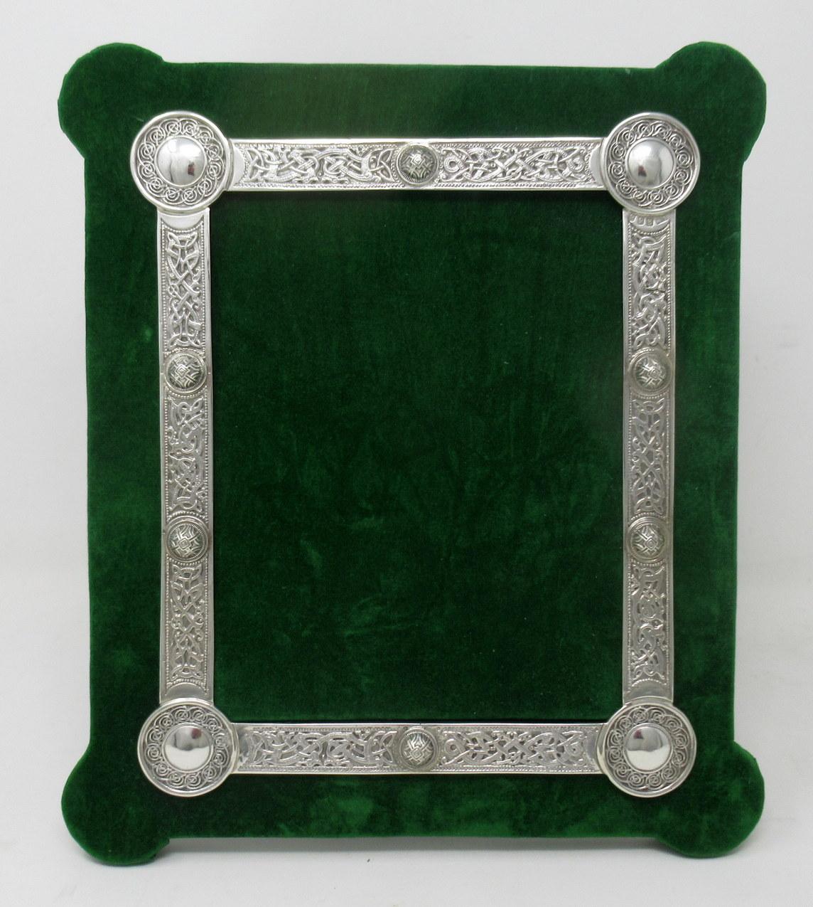 A superb and quite rare example of mid-century Irish sterling silver portrait photograph frame of generous proportions. 

With all-round lavish decorative applied silver border of traditional Celtic design and corner circles with similar