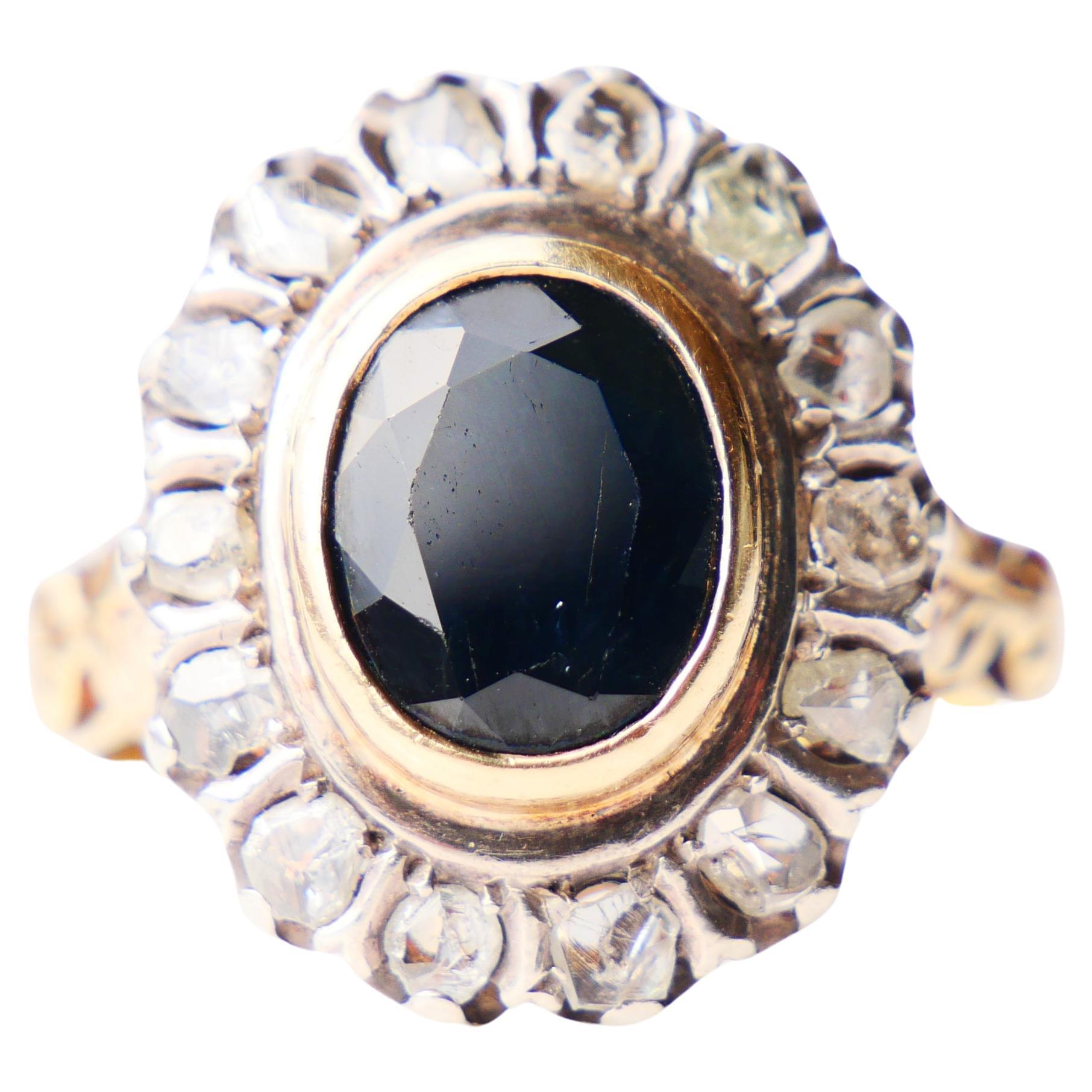 Antique or Vintage Italian Blue Sapphire and Diamonds Ring. 18K Greenish Yellow Gold + top of the crown in White Gold (or Silver).

Worn Italian hallmarks on the band, circa first half of 20th century. Marked 750 for 18K Gold.
Crown is 20mm x 17mm x