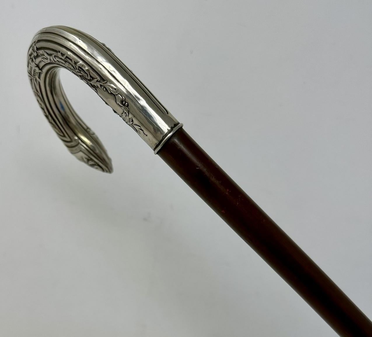 black walking cane with silver handle