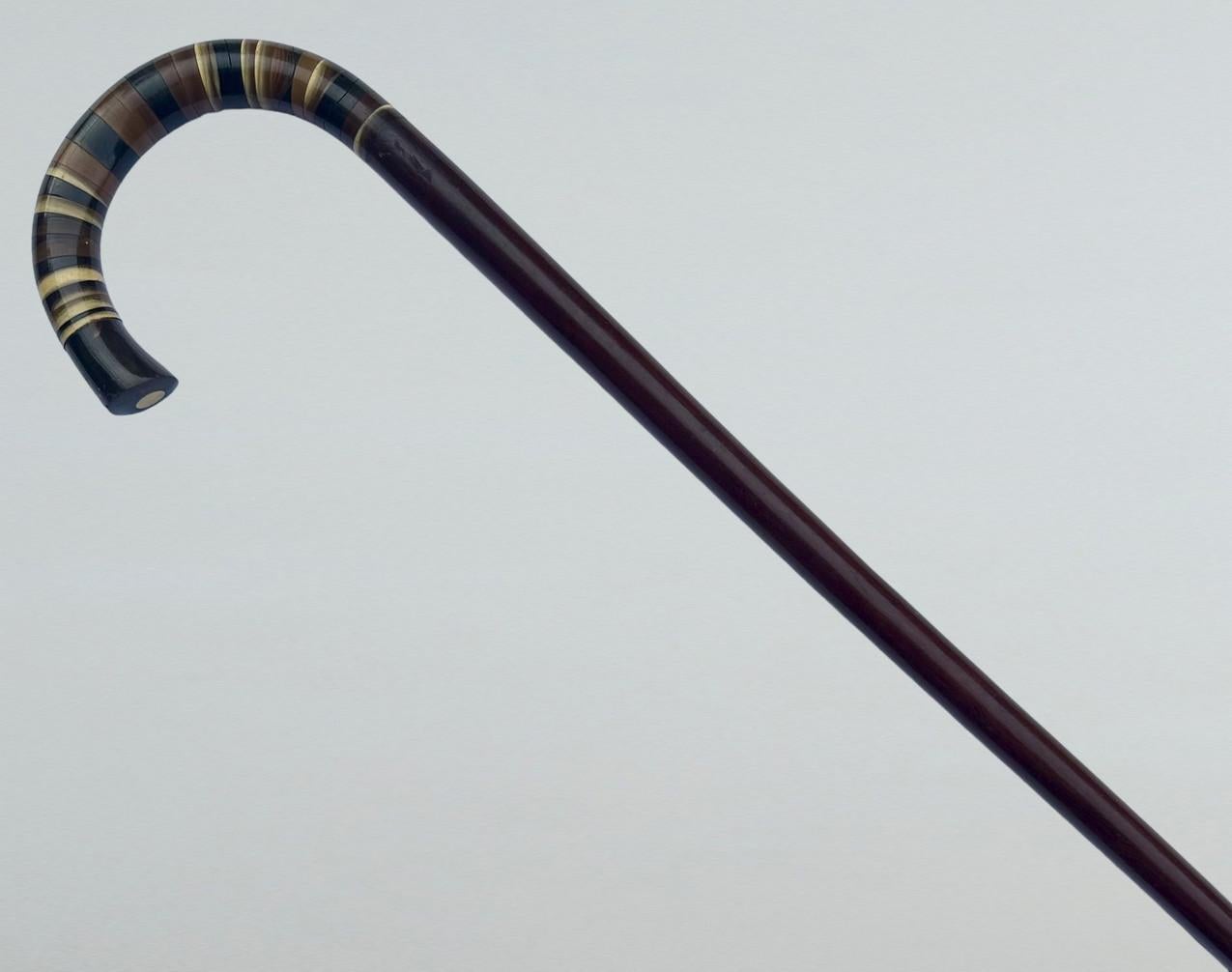 Stylish Solid Polished Dark Brown Malacca Wood and Sectional Horn Crook Handle in colours Lady’s or Gentleman’s Walking Stick or Cane with Traditional ornately cast Crook shaped handle, of French or English origin, complete with its original horn