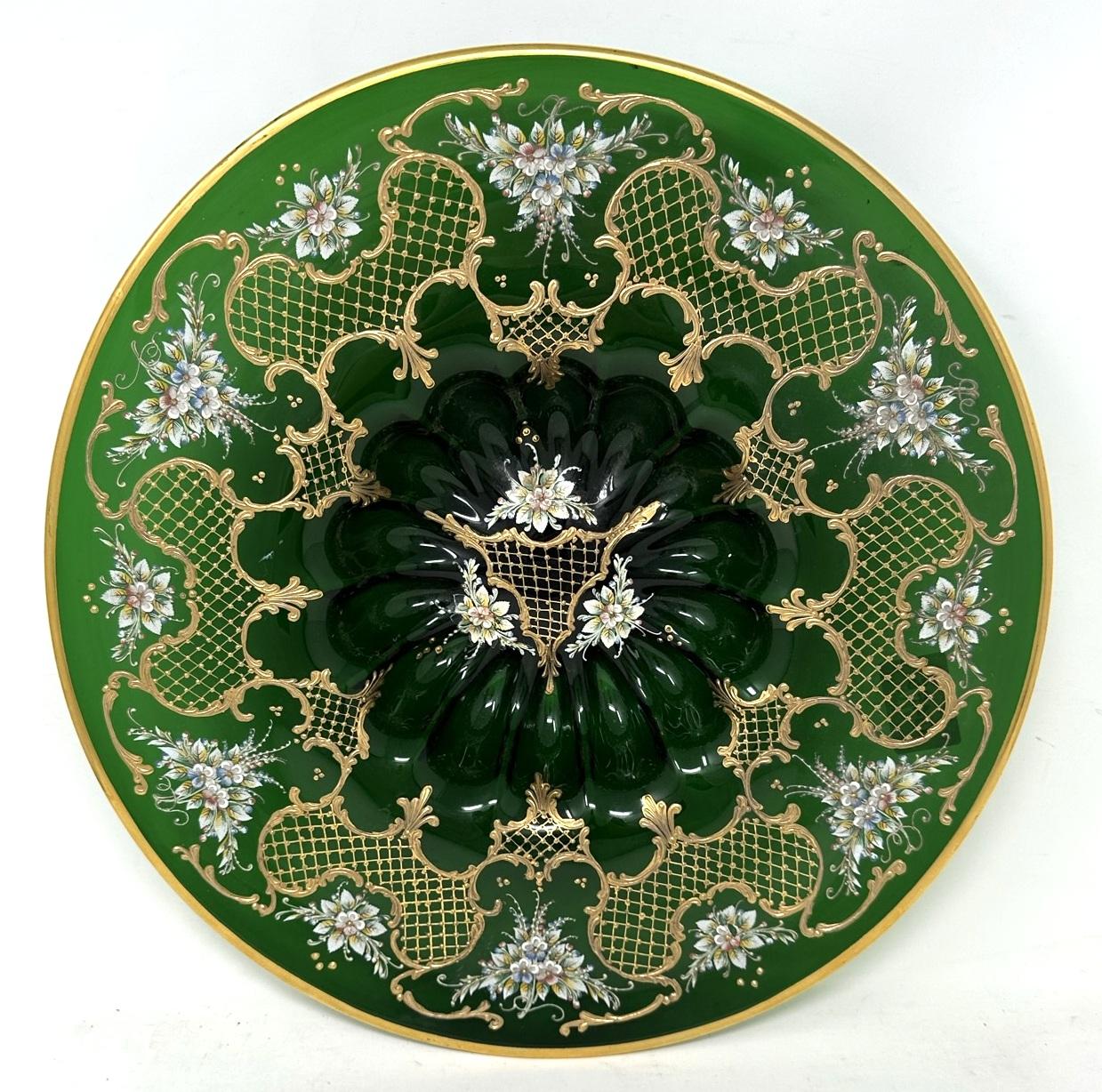 Stunning example of a Moser Bohemian hand enameled floral and raised gilt Emerald Green Glass deep dish Centerpiece or Cabinet Plate of large proportions, early to mid-Twentieth Century.  

The entire area with lavish raised gilding and a border