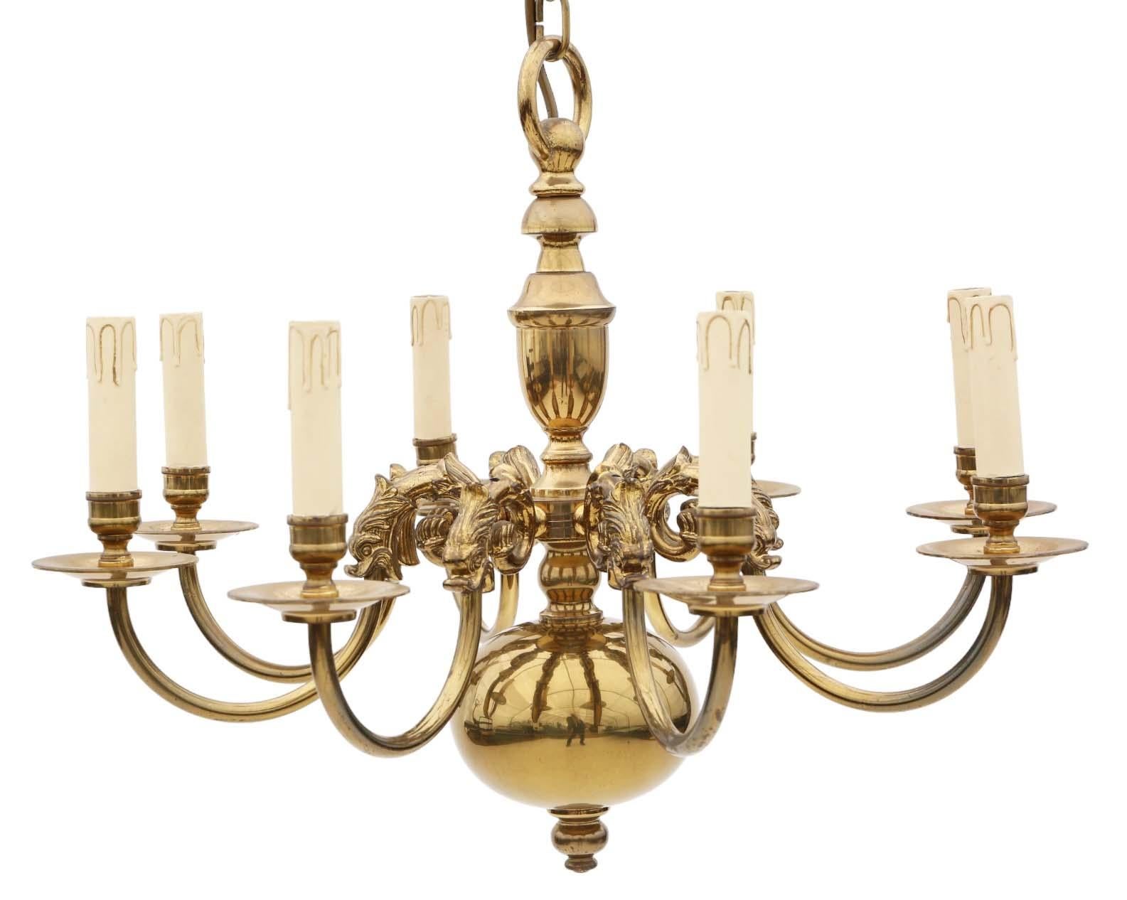 Vintage Ormolu Brass Chandelier with 8 Lamps/Arms.

This chandelier boasts a patinated gold finish on brass and other metals, adding to its vintage appeal.

Around 60 years old, it carries a nice age and patina, sure to catch the eye and enhance any