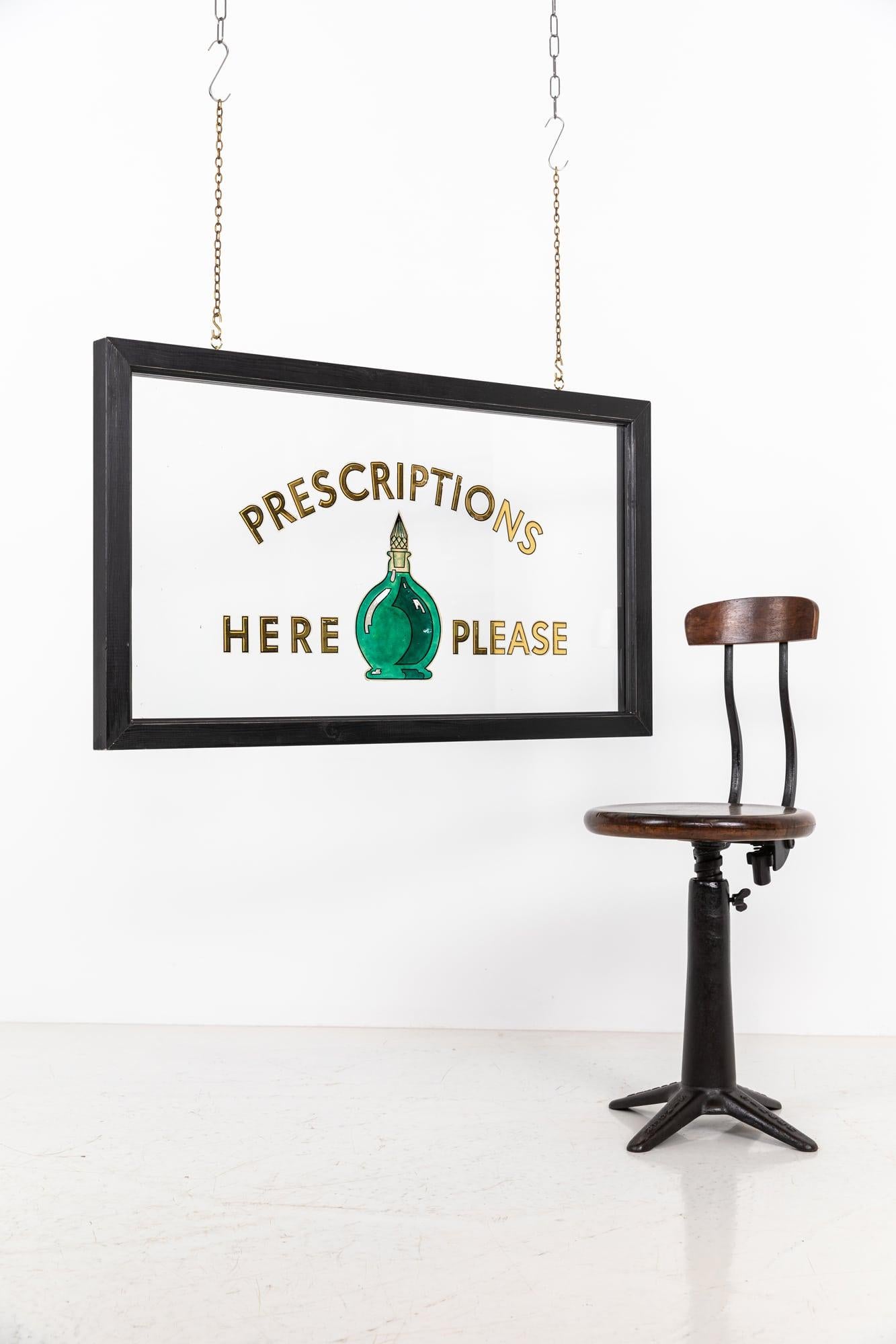 An elegant reverse painted glass chemist's sign. c.1930

Gilt lettering and green carboy, reverse painted on clear thick plate glass. Set into a simple ebonised wooden frame. 