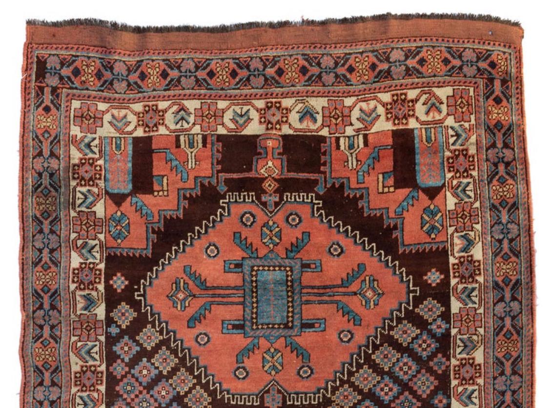This is a lovely antique Persian Afshar rug hand knotted in Iran in the 1900s-1910s and measures 4.2 x 6.5 ft.

 