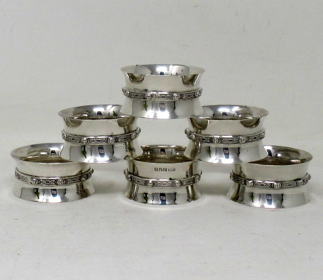An exceptionally fine set of six Irish sterling silver dinner napkin rings of outstanding quality and good heavy gauge. 

Each of waisted form with a stylish decorative Old Irish Celtic Design applied band. 

Mark of ISL for Irish Silver Limited,