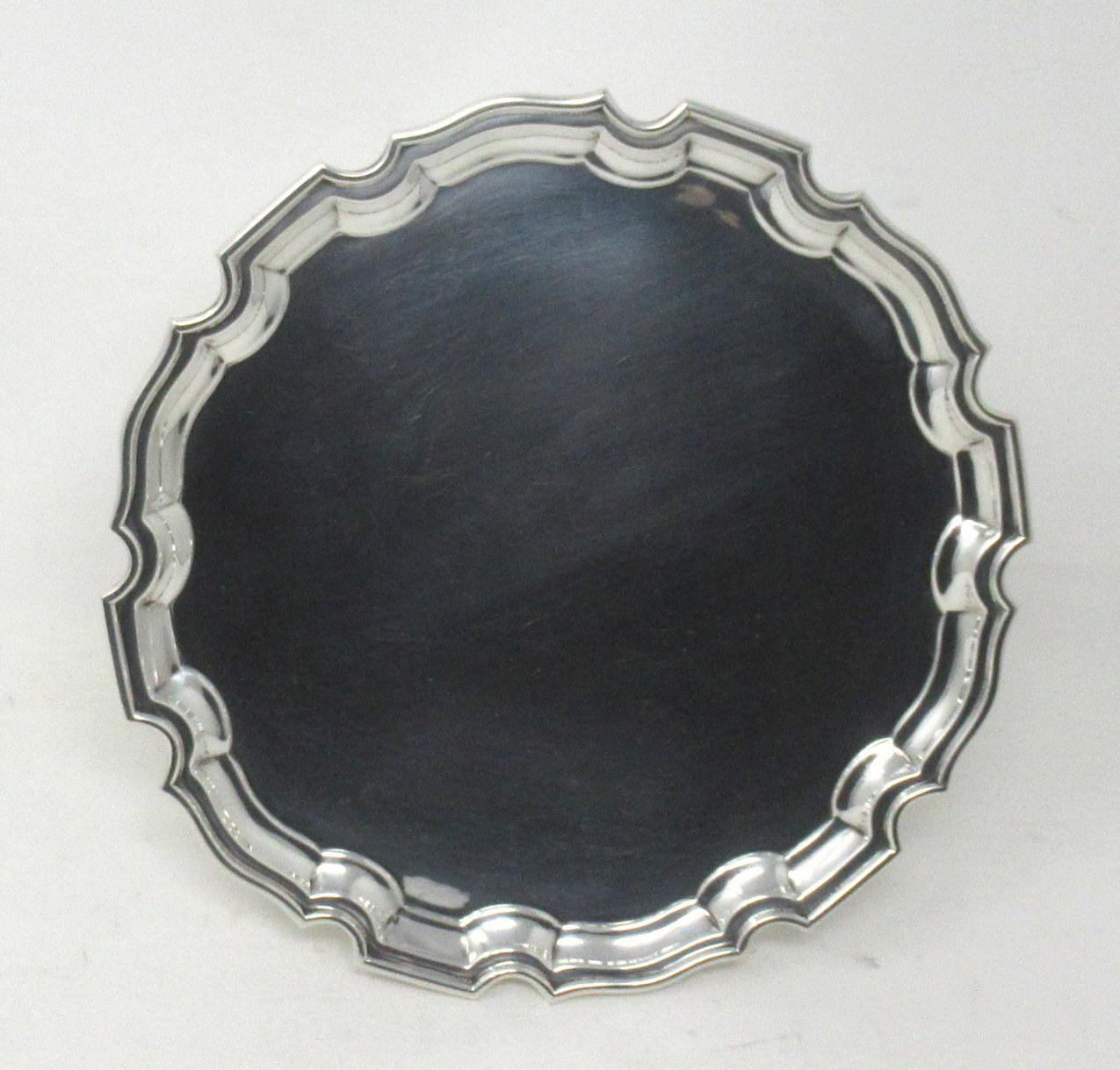 A superb example of a mid century heavy gauge sterling silver flat card tray of outstanding quality and condition for such an early silver item. 

The shaped circular form with stylish raised piecrust rim detailing, edged with a flat rim edge.