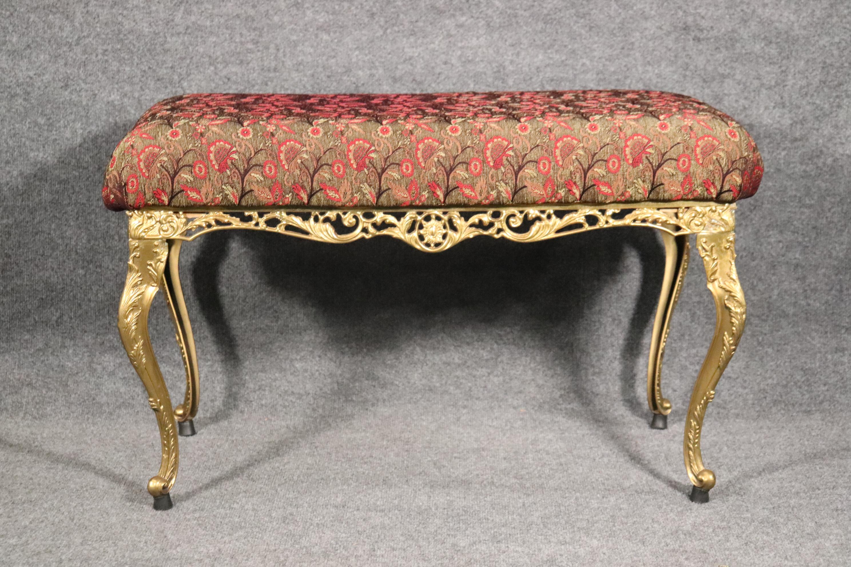 Dimensions: H: 20 1/2in in W: 34in D: 19in 
This Louis XV style bench is a high quality piece made from brass accompanied by a removable upholstered cushion. This bench/ottoman will add a nice sense of luxury and character into your place of