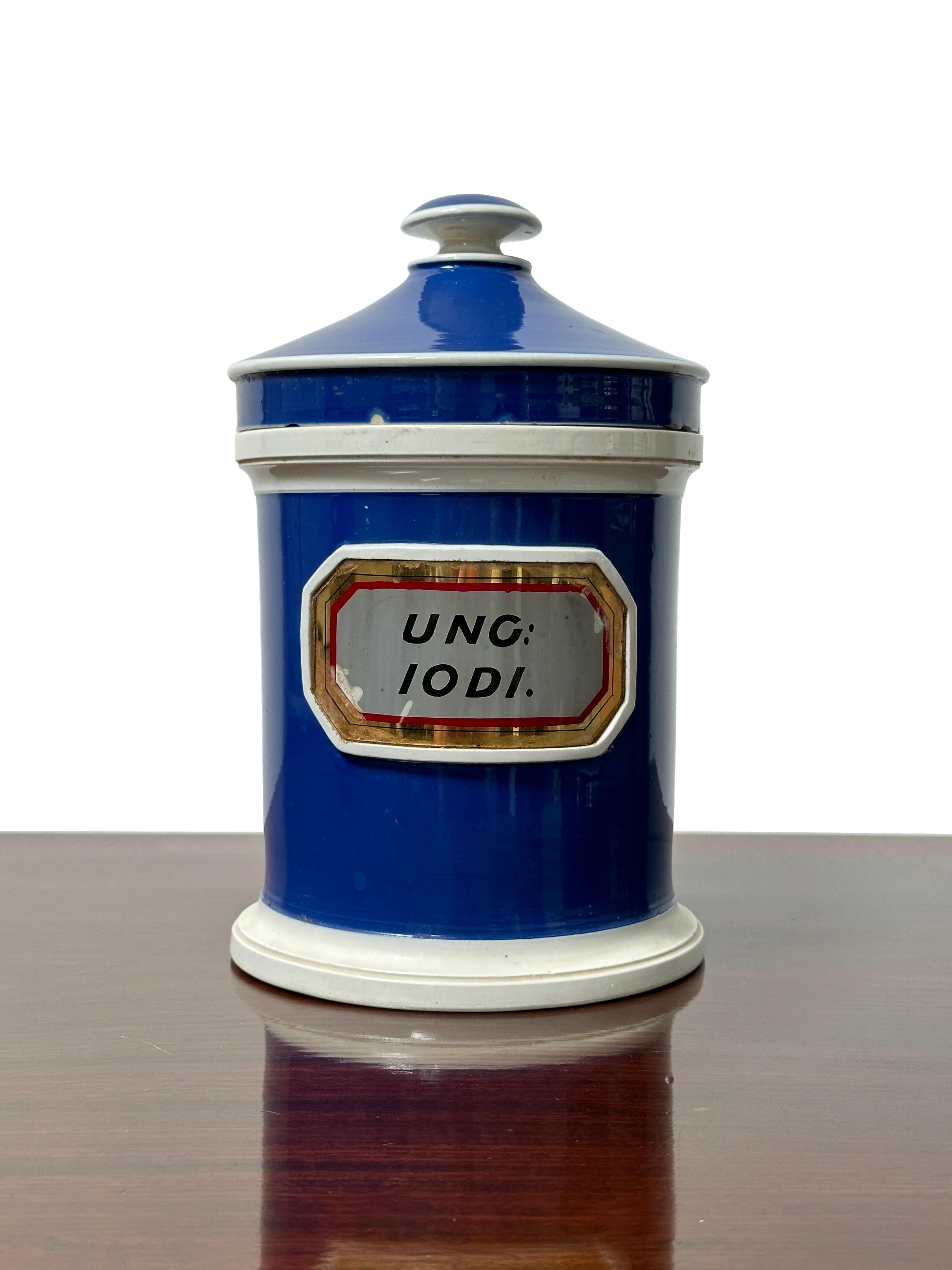 - A beautiful blue and white Victorian apothecary jar, circa 1900.
- Excellent glass and gilt lettered plaque to the front with original lid. 
- The fine white, gold and red glass covered foil label reads 'UNG: IODI.'
- Wonderful condition for its