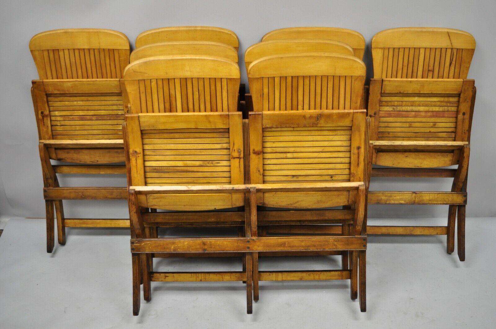 Antique vintage wood slat double folding seat theater school old pew chair. Listing includes book slot to rear of one chair, folding frames, great patina, solid wood construction, beautiful wood grain, very nice antique item, quality American