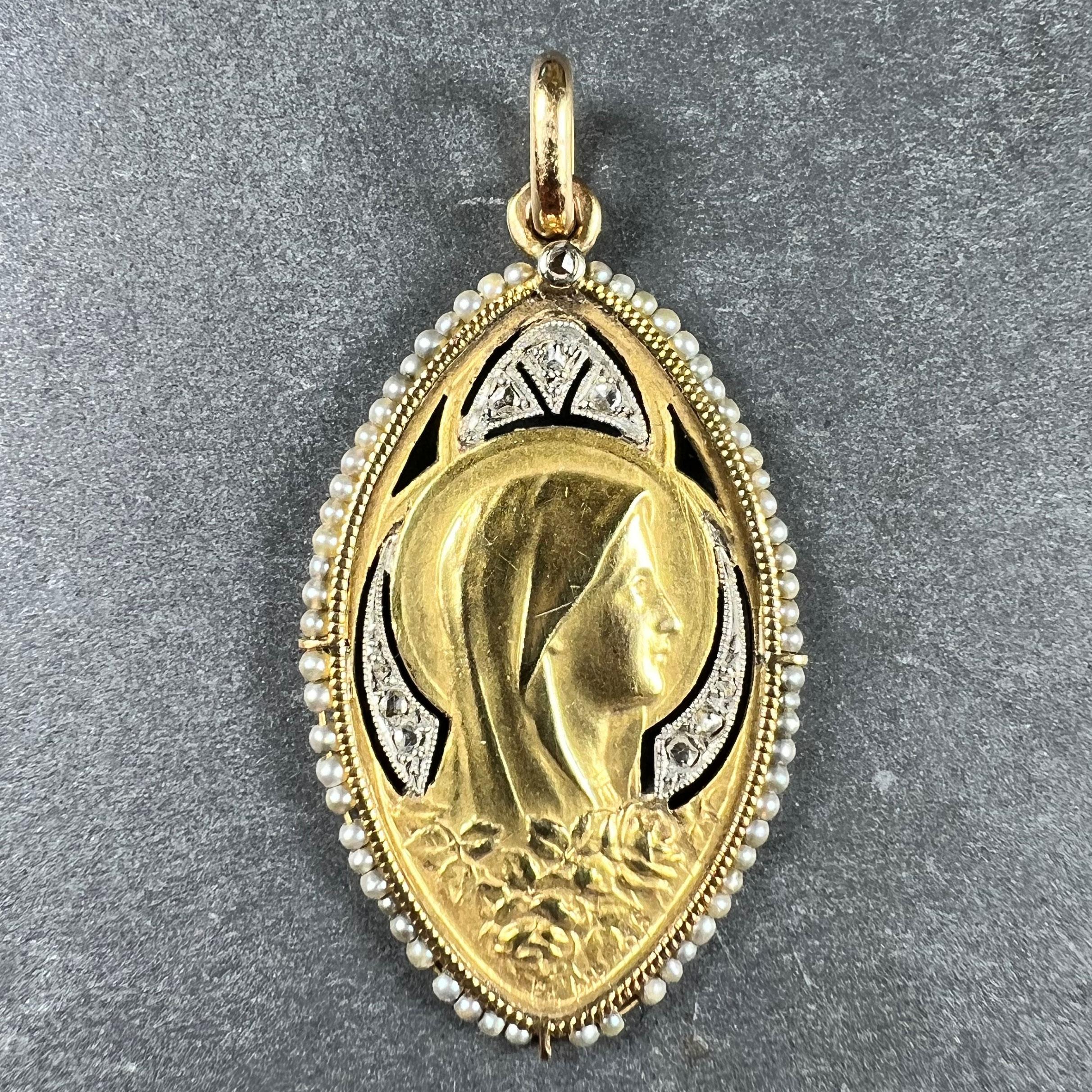 An 18 karat (18K) yellow gold pendant designed as a navette or elongated oval medal representing the Virgin Mary with a halo above a bank of roses, surrounded by 9 rose-cut diamonds set in silver-topped gold,  surrounded by 64 natural white seed