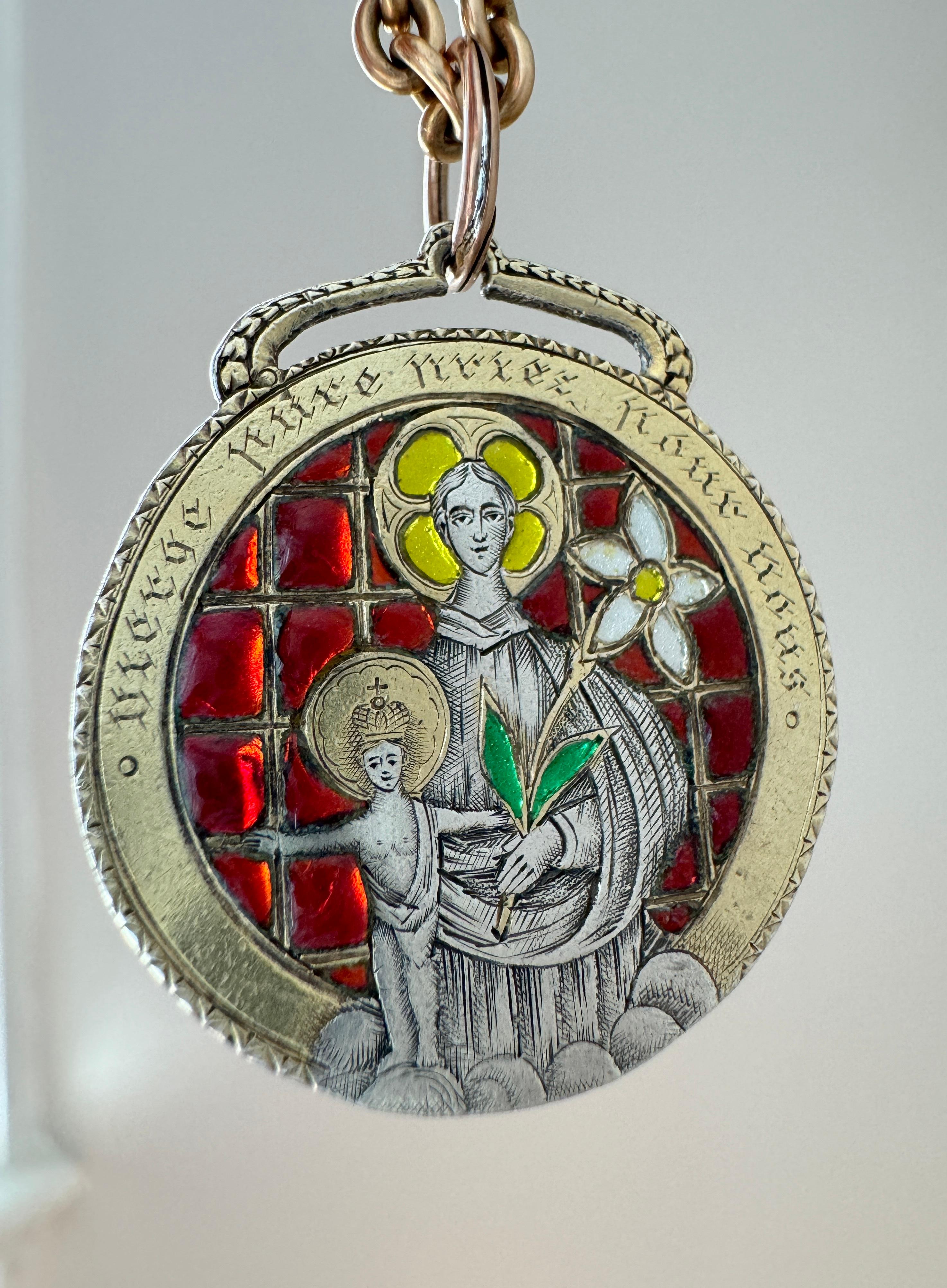 This exceptional double sided medallion of Virgin Mary and St. Joseph was hand fabricated circa 1900 by Enguerrand du Suau de la Croix of France. The pendant has been hand fabricated in silver-gilt and adorned with double high relief cabochons of
