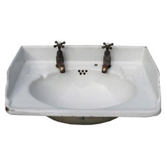 Lavabo antiguo de hierro fundido esmaltado vítreo
