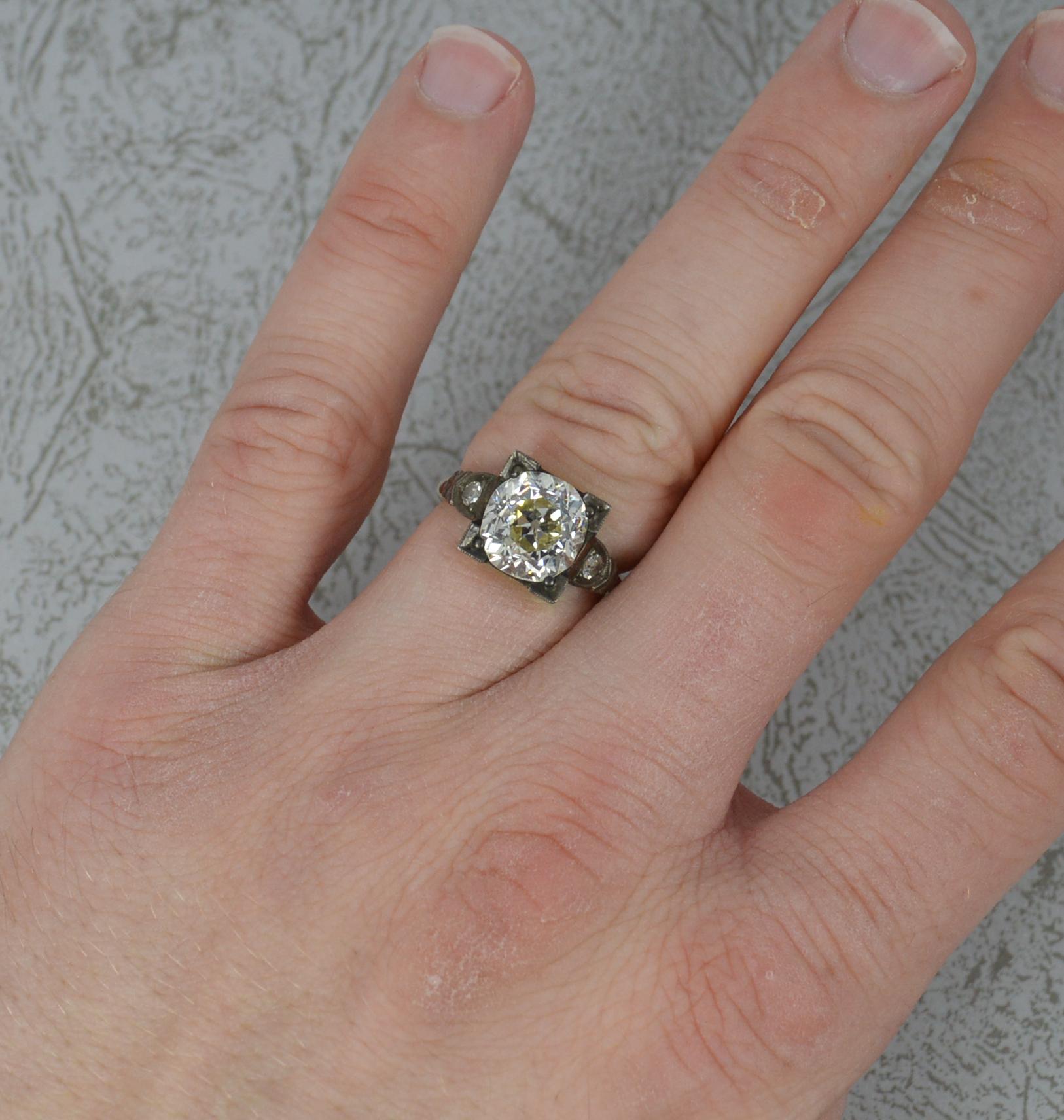 One stunning old cut diamond engagement ring.
A late Victorian piece, circa 1900. 18 carat yellow gold shank.
Designed with one very large, natural old cut diamond to centre. 9.1mm x 9.4mm approx, 3.25 carats. Complete with a smaller old cut diamond