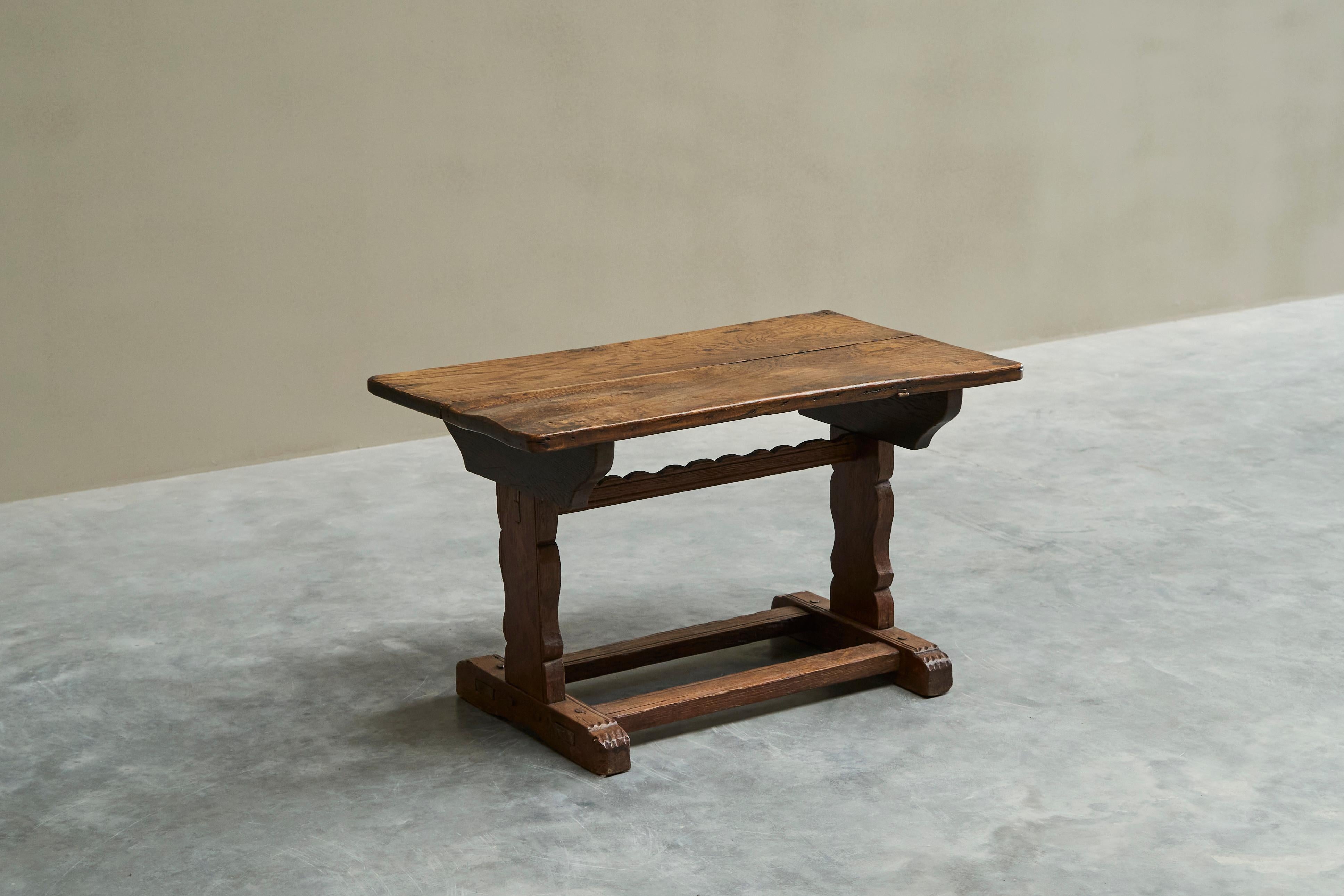 Antique Wabi Sabi Style Trestle Side Table in Solid Oak

A wonderful antique side table in solid carved oak. Great traditional design with a trestle base with stretchers. Nicely carved subtle decoration can be found on different elements and the