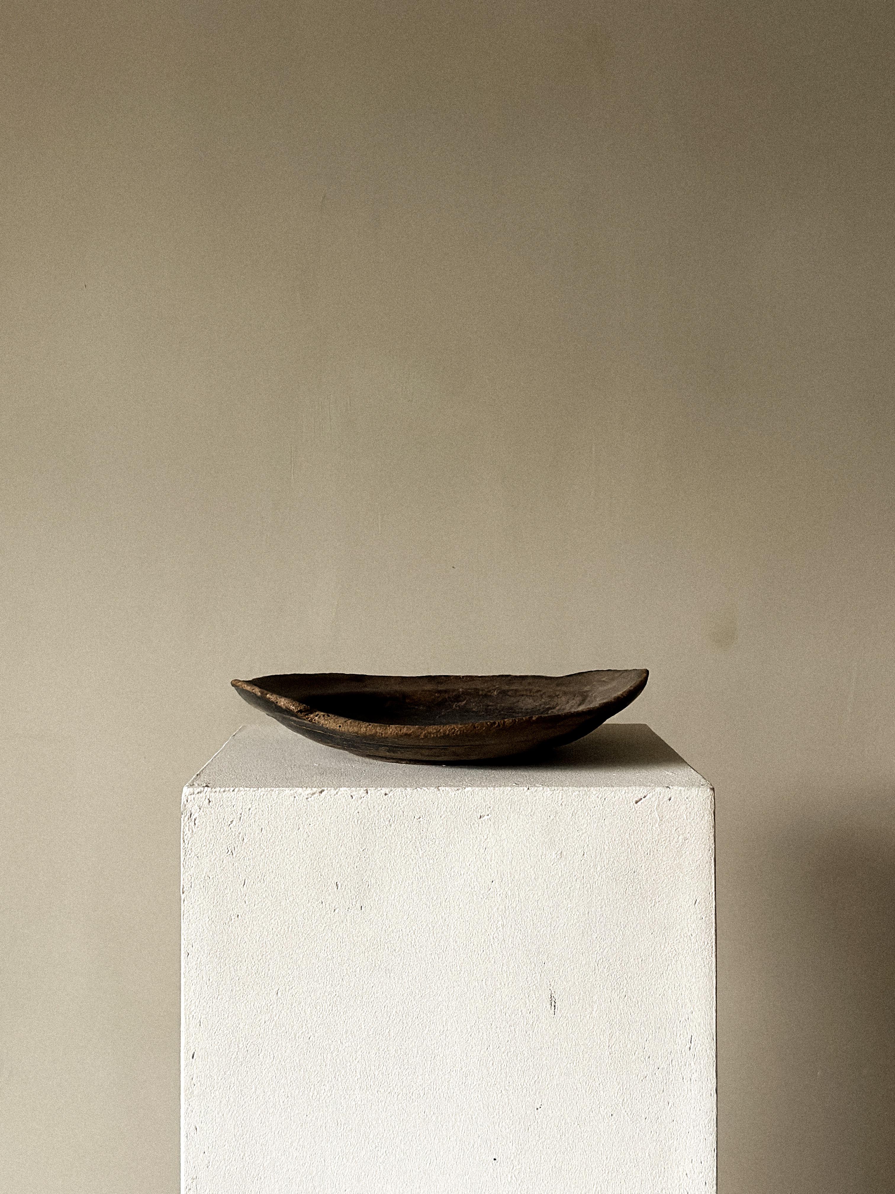 A wonderful antique wabi sabi wooden plate with beautiful patina from age and use. 