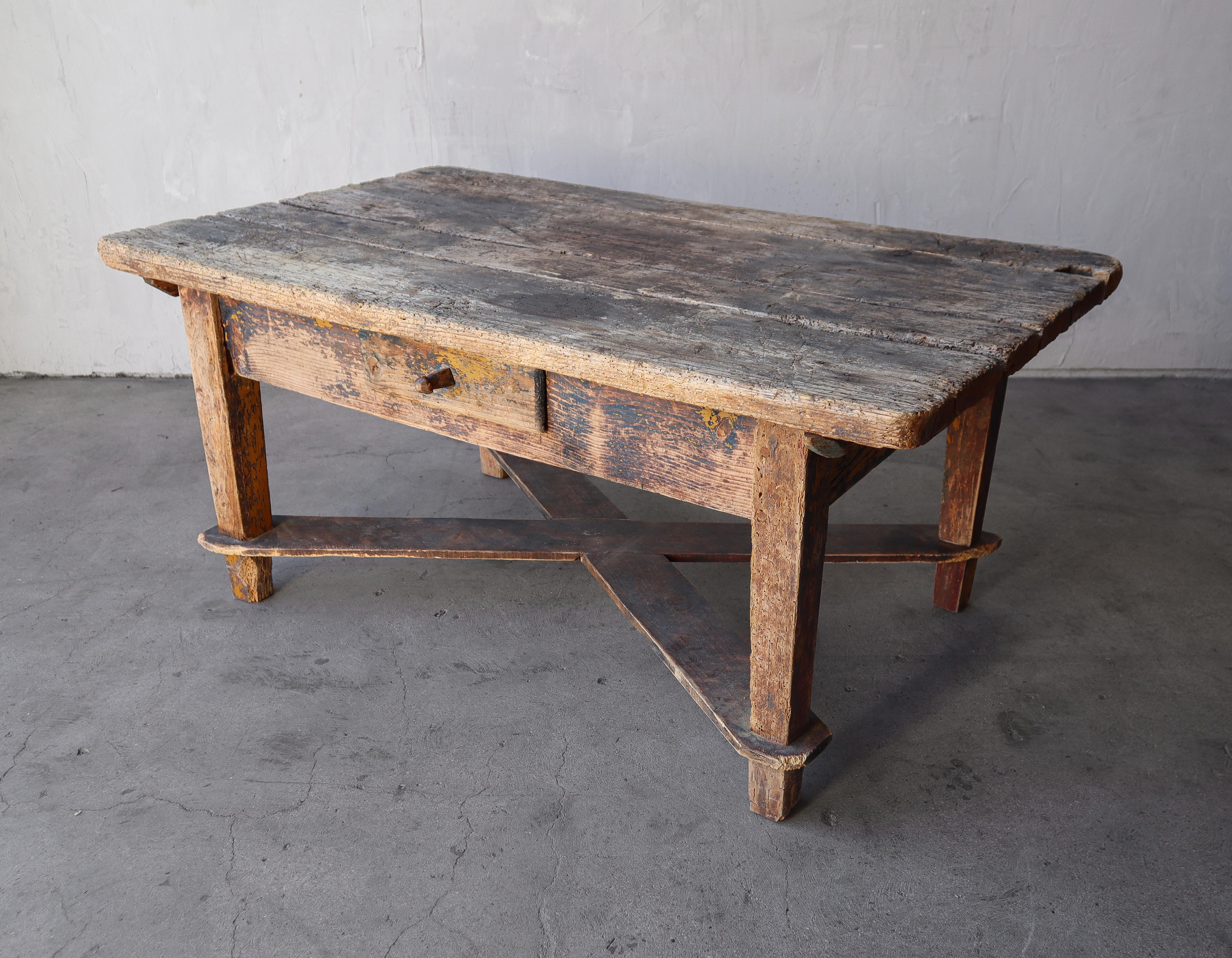 If wabisabi is your decor style, this table feel right at home.   A great antique decor accent piece with nice details like the x base stretcher, paint remnants and funky rusted drawer pull.  Table features a single functional drawer.

Table is in