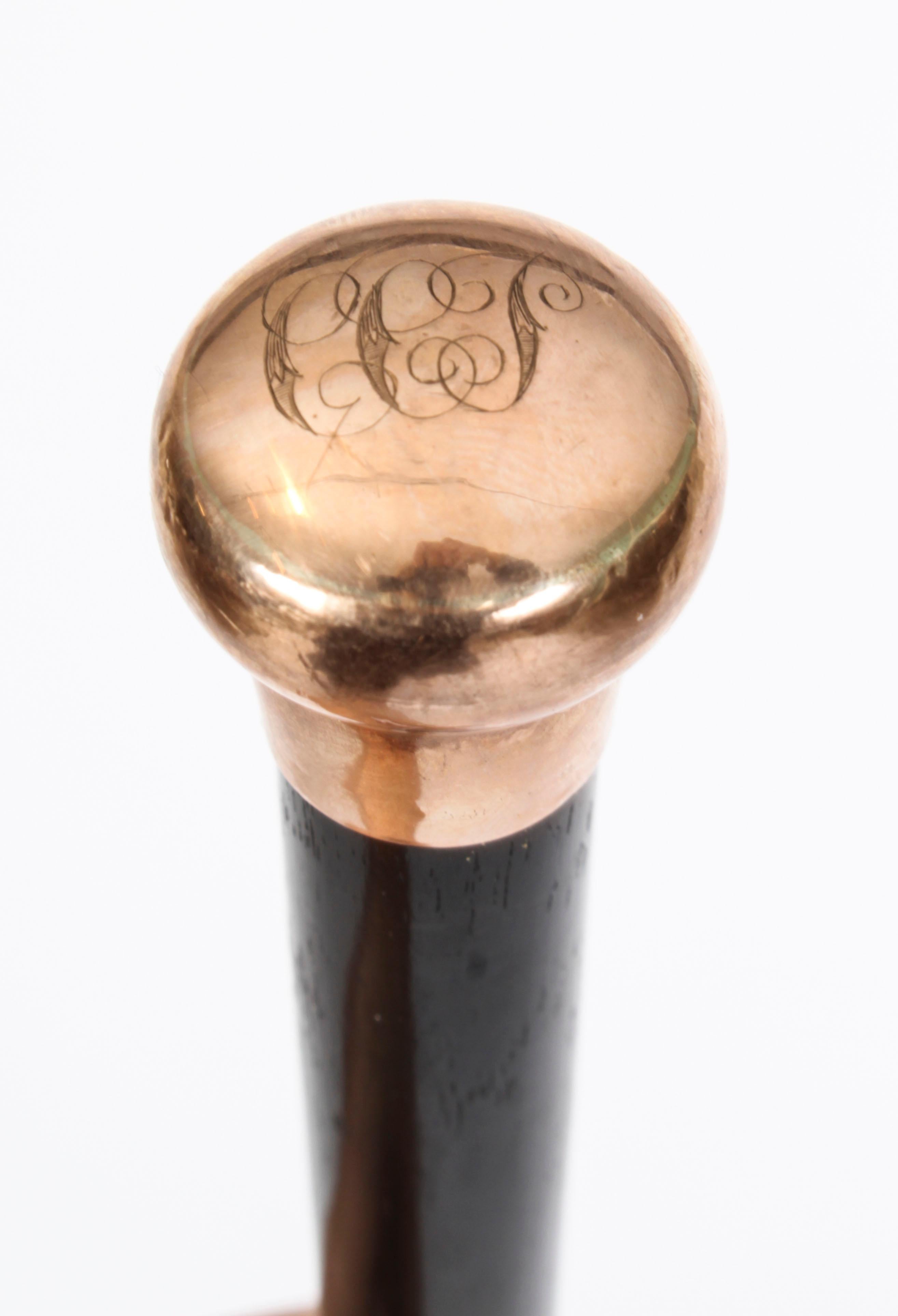 This is an exquisite antique Victorian walking cane with a 9ct gold pommel, dating from the late 19th Century.

The gold handle is round in shape, is hallmarked .375 and has decorative engraved decoration on the top.

The pommel is directly