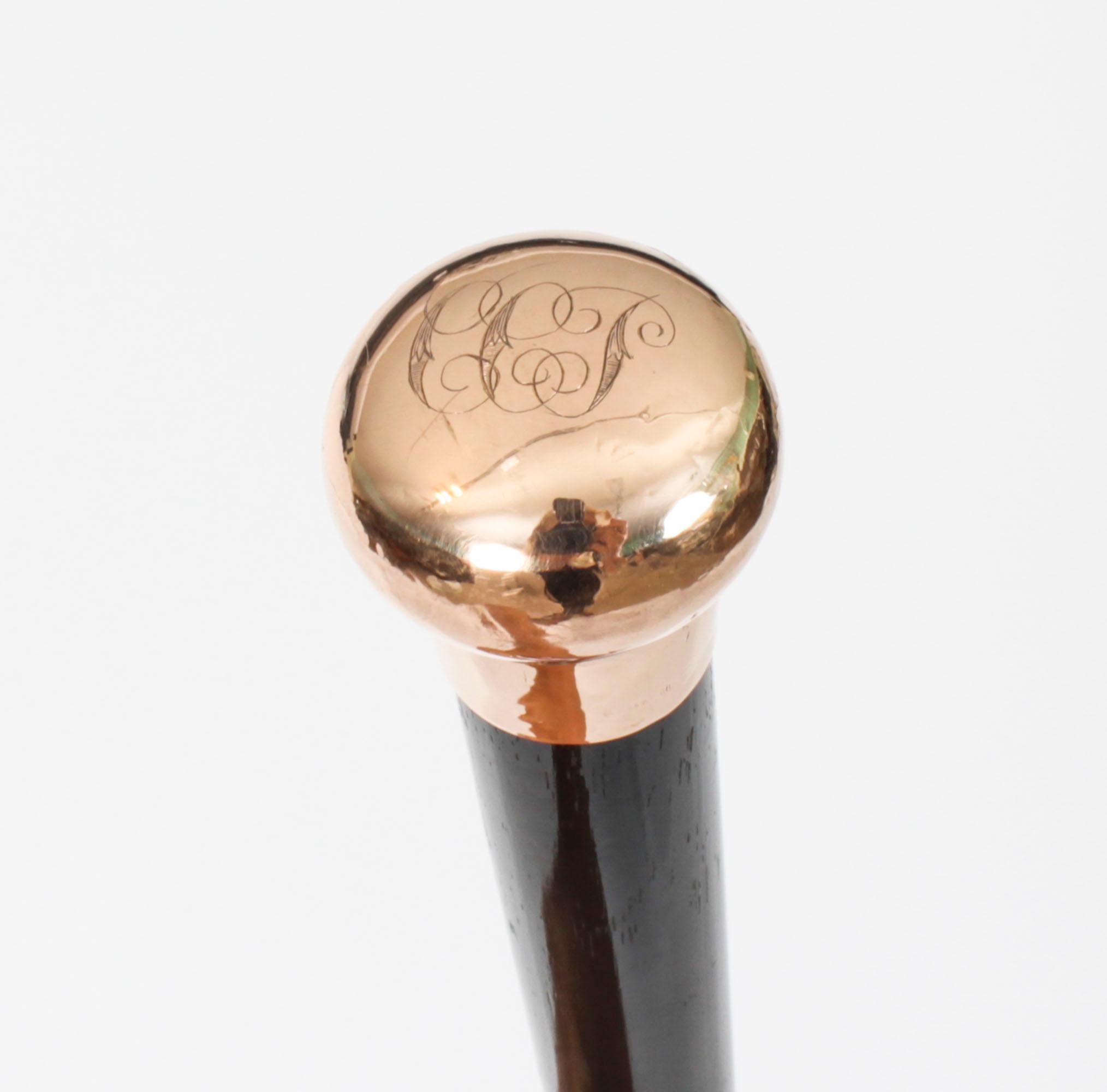 This is an exquisite antique Victorian walking cane with a 9ct gold pommel, dating from the late 19th Century.

The gold handle is round in shape, is hallmarked .375 and has decorative engraved decoration on the top.

The pommel is directly mounted