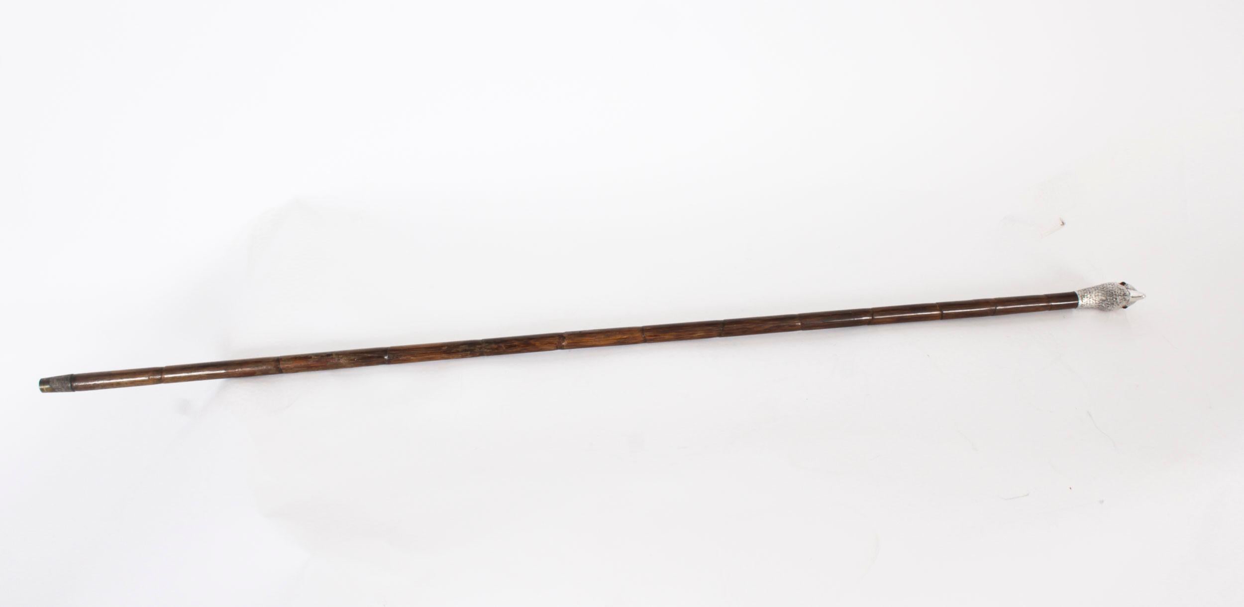 This is a beautiful Antique English sterling silver duck head handle walking stick bearing the makers mark for Ben Cox of London and hallmarks for 1897.
 
This charming walking cane features a finely cast sterling silver duck head handle with glass