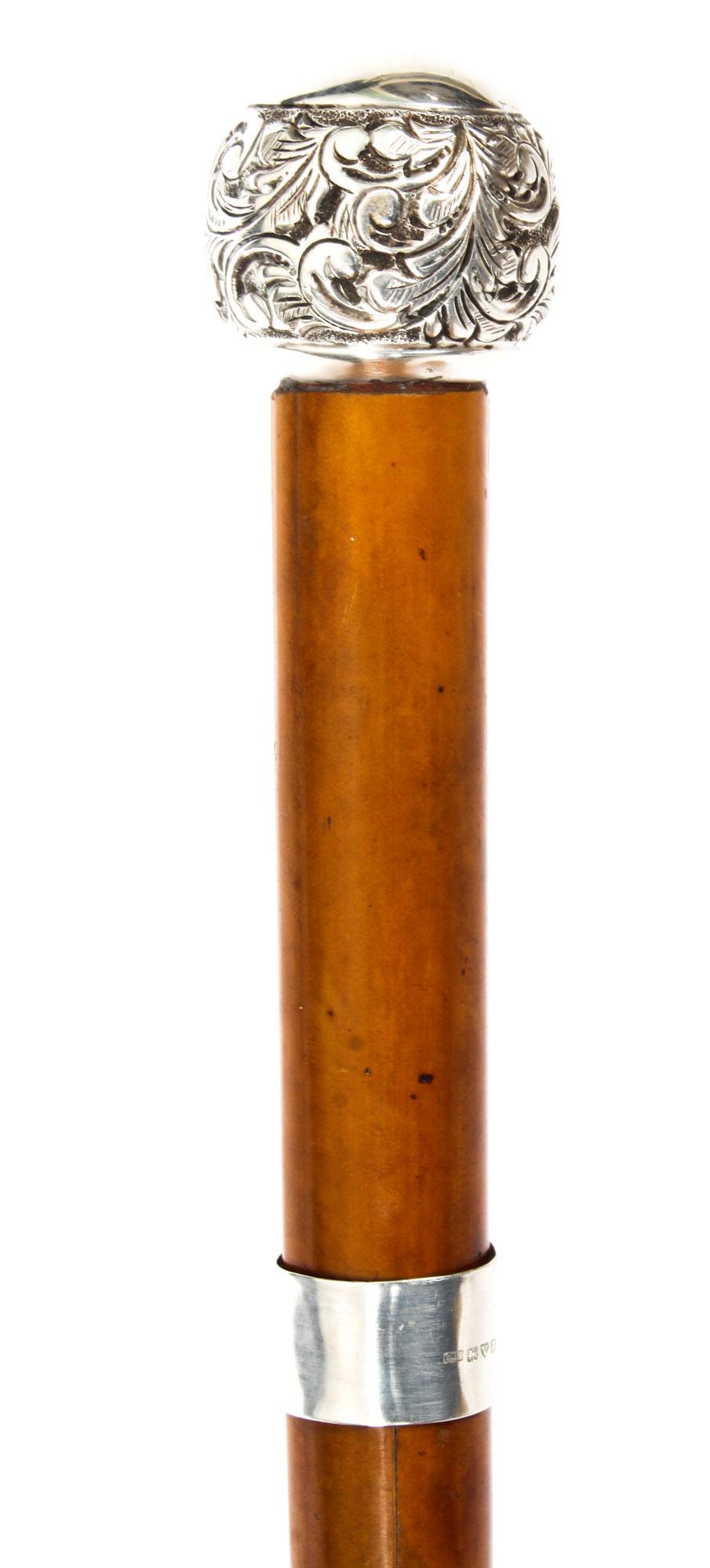 This is a superb silver-mounted Malacca gentleman's sword stick dating from the mid-19th century.

It features a globular silver embossed pommel cast with a garland of oak leaves on a oeil de perdrix ground and a later silver collar on a malacca