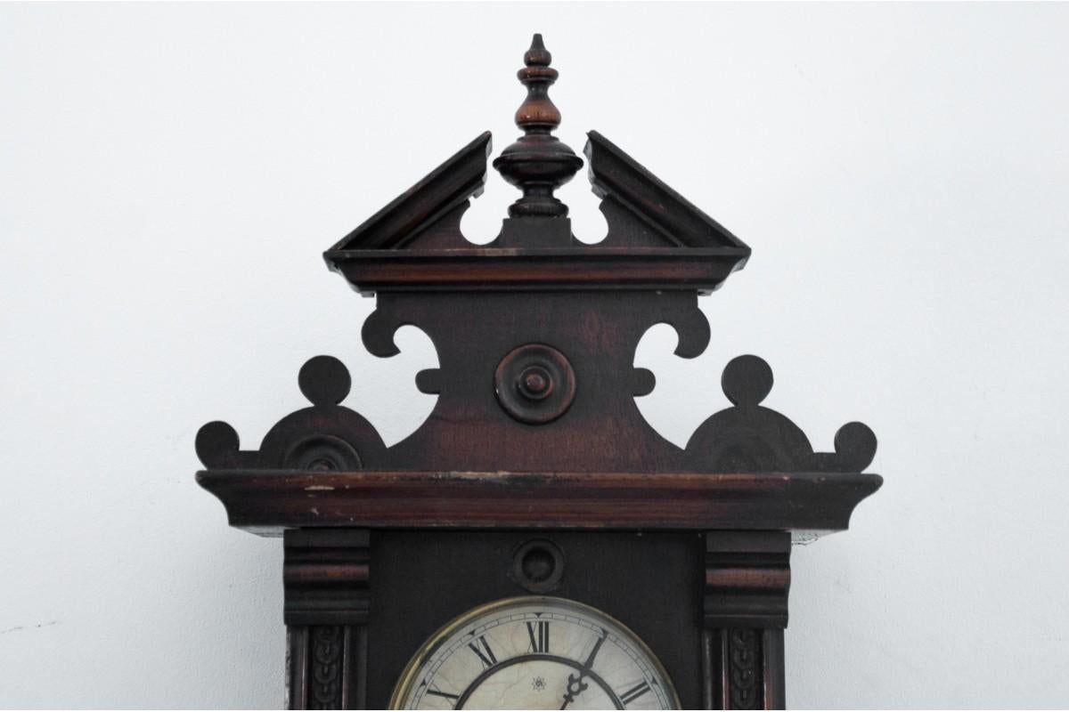 Antique wall clock, Western Europe, circa 1910.

dimensions: height: 80 cm, width: 31 cm, depth: 17 cm.

