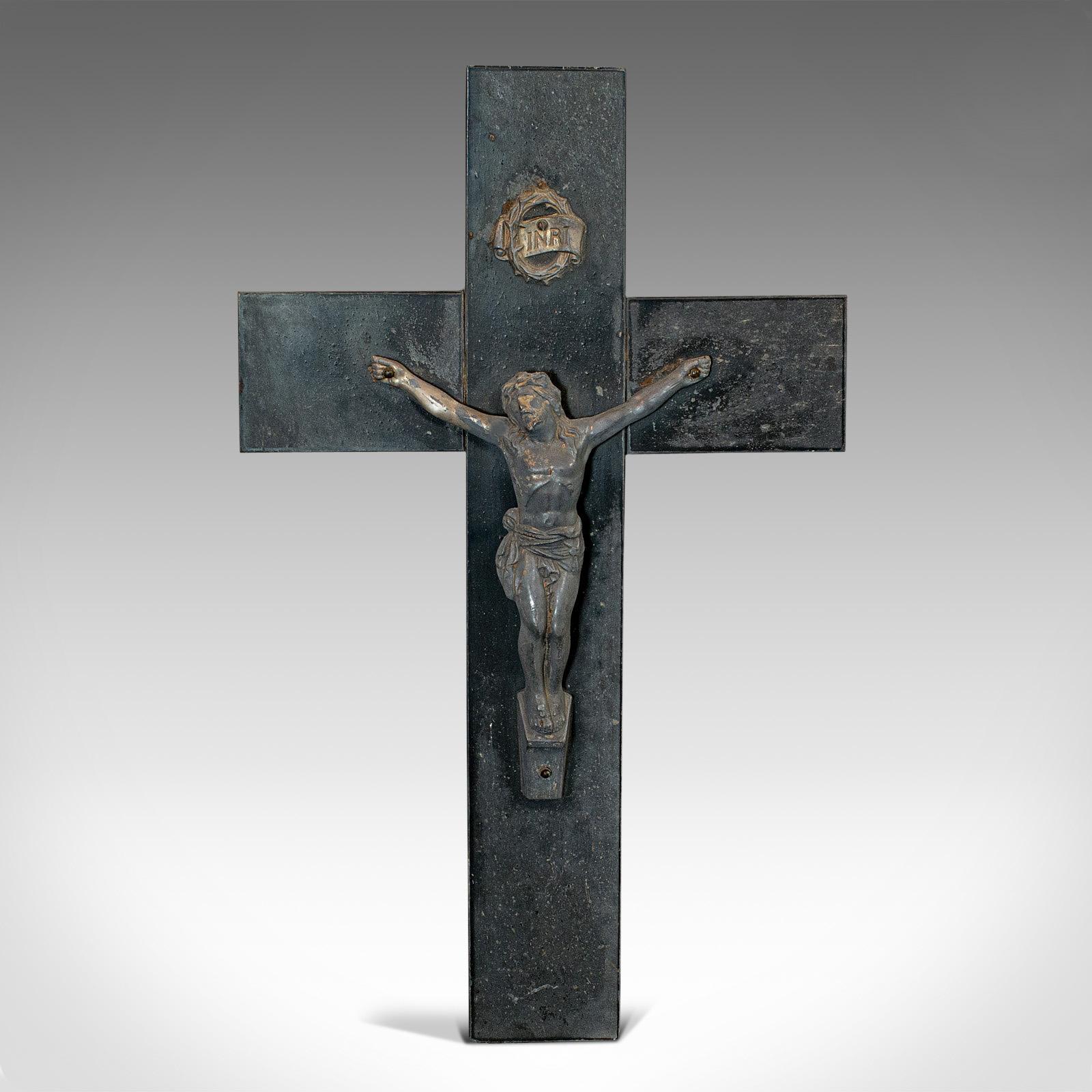 This is an antique wall crucifix. An English, bronze spelter and slate depiction of Jesus Christ on the cross, dating to the late 19th century, circa 1900.

Timeless iconography
Displays a desirable aged patina
Bronze spelter Christ in good