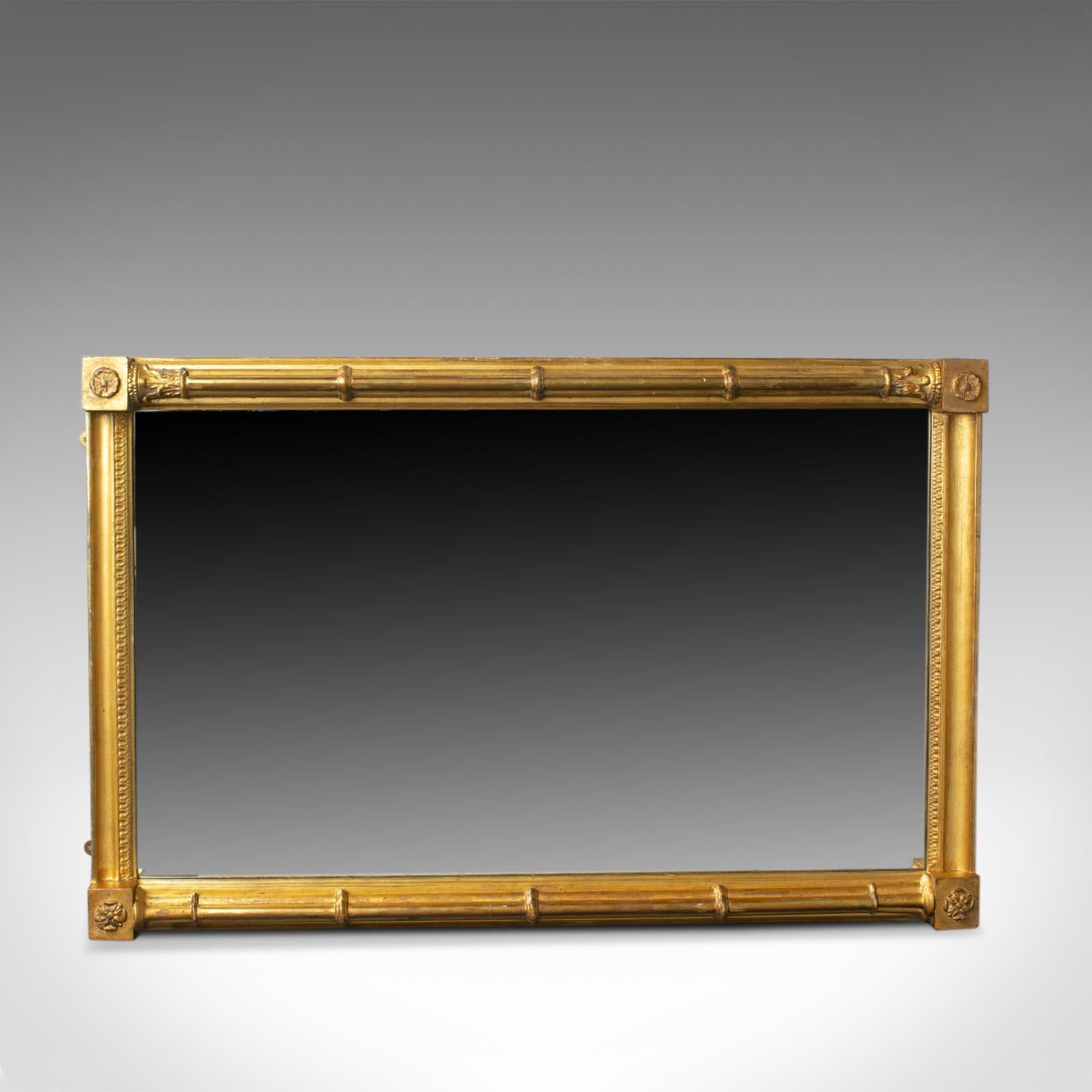 This is an antique wall mirror. An English, Georgian, giltwood console mirror dating to the turn of the 19th century, circa 1800. 

Attractive patina to the giltwood frame
Banded cluster column design to the longer edges
One with Corinthian