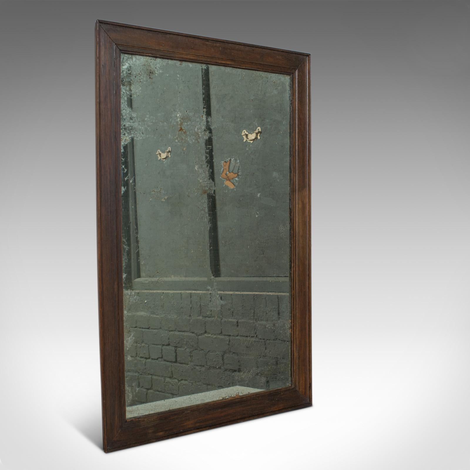 This is an antique wall mirror. An English, Victorian, distressed, oak mirror dating to the mid-19th century, circa 1850.

Substantial and reassuringly heavy
Beaded oak frame benefits from good, consistent color
Grain interest and a desirable