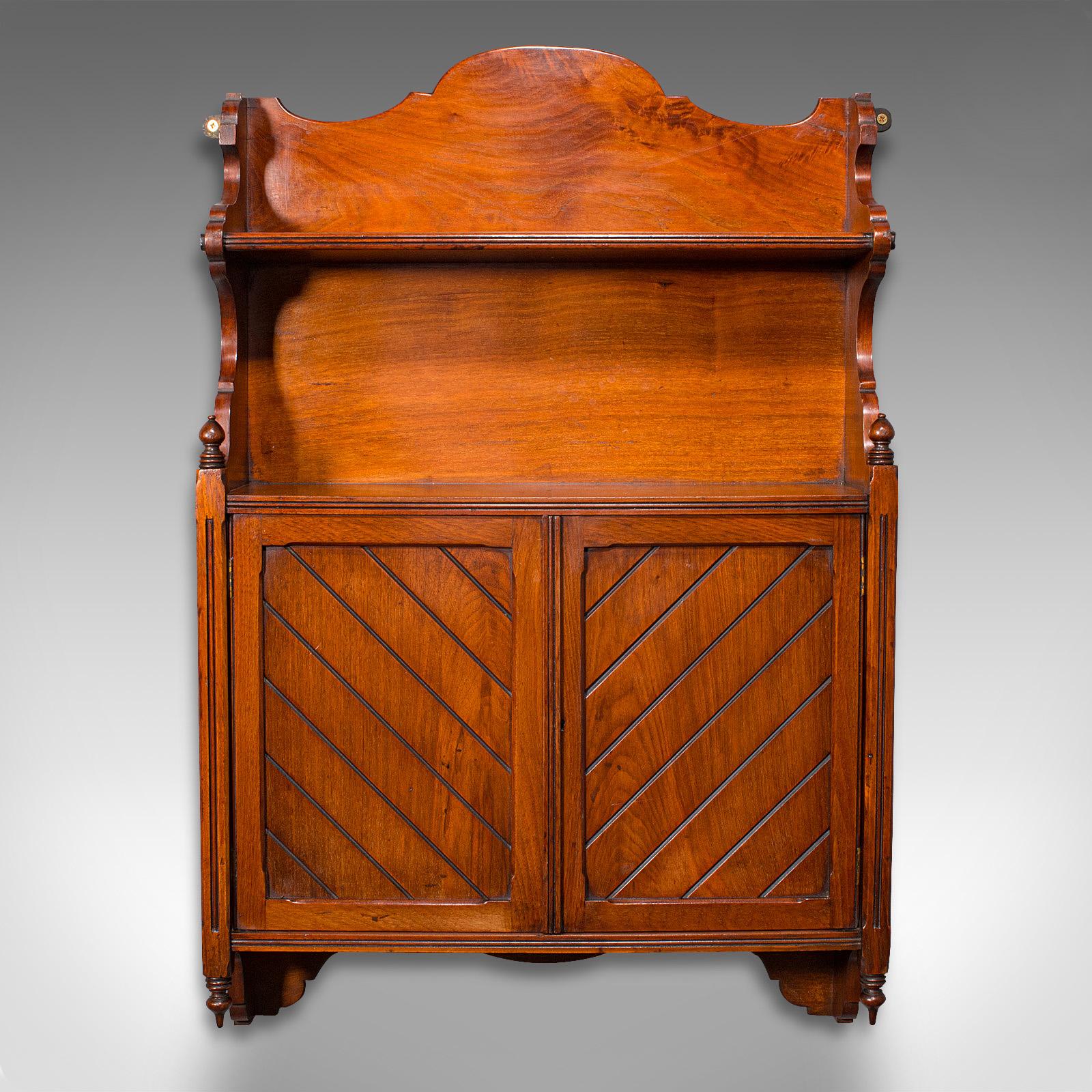 This is an antique wall-mounted cabinet. An English, mahogany hanging whatnot, dating to the Victorian period, circa 1880.

Delightfully presented cabinet with fine craftsmanship
Displays a desirable aged patina in good order
Select mahogany