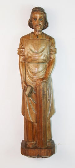 Antique Wall Mounted Walnut Carved Sculpture Of Christ Depicted as a Carpenter