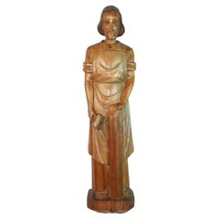Antique Wall Mounted Walnut Carved Sculpture Of Christ Depicted as a Carpenter