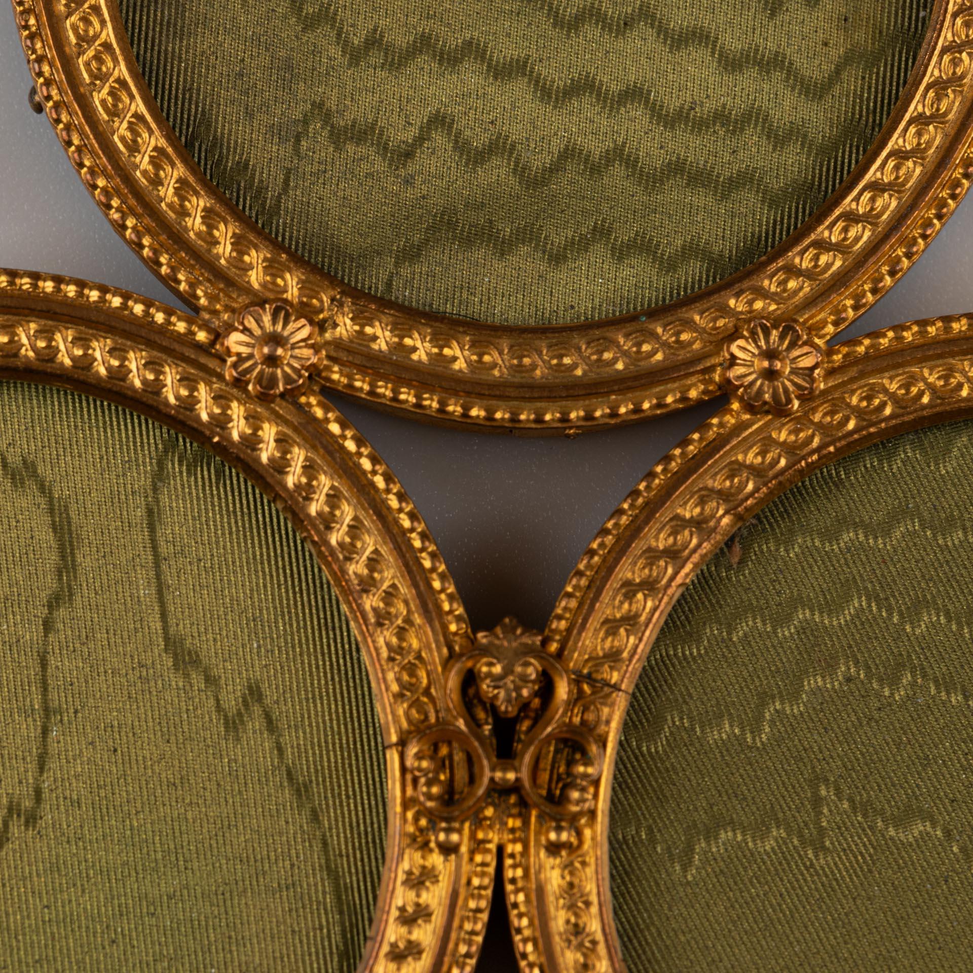 Beautiful brass picture frame for wall installation, France, circa 1860.
For three pictures, former probably used as a family picture frame.
Picture size of each frame: 4,5 cm x 4,5 cm.
Hanging chain on the top for wall installation.

