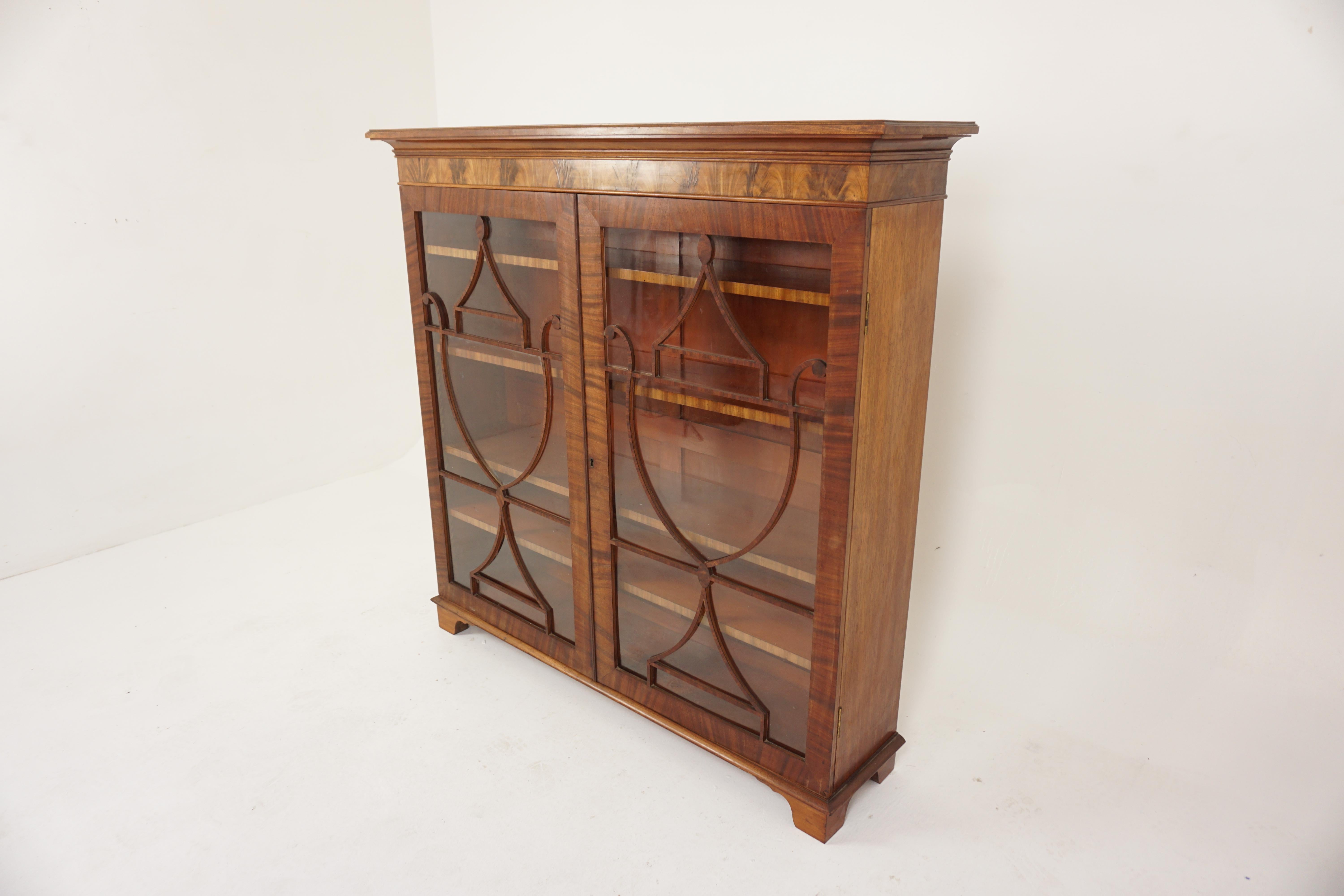 Antique Walnut 2 door bookcase, display cabinet China cabinet, Scotland 1910, H708.

Scotland 1910
Solid walnut + veneers
Original Finish.
Rectangular moulded top.
Pair of original glass doors with moulding on the front.
Four wooden