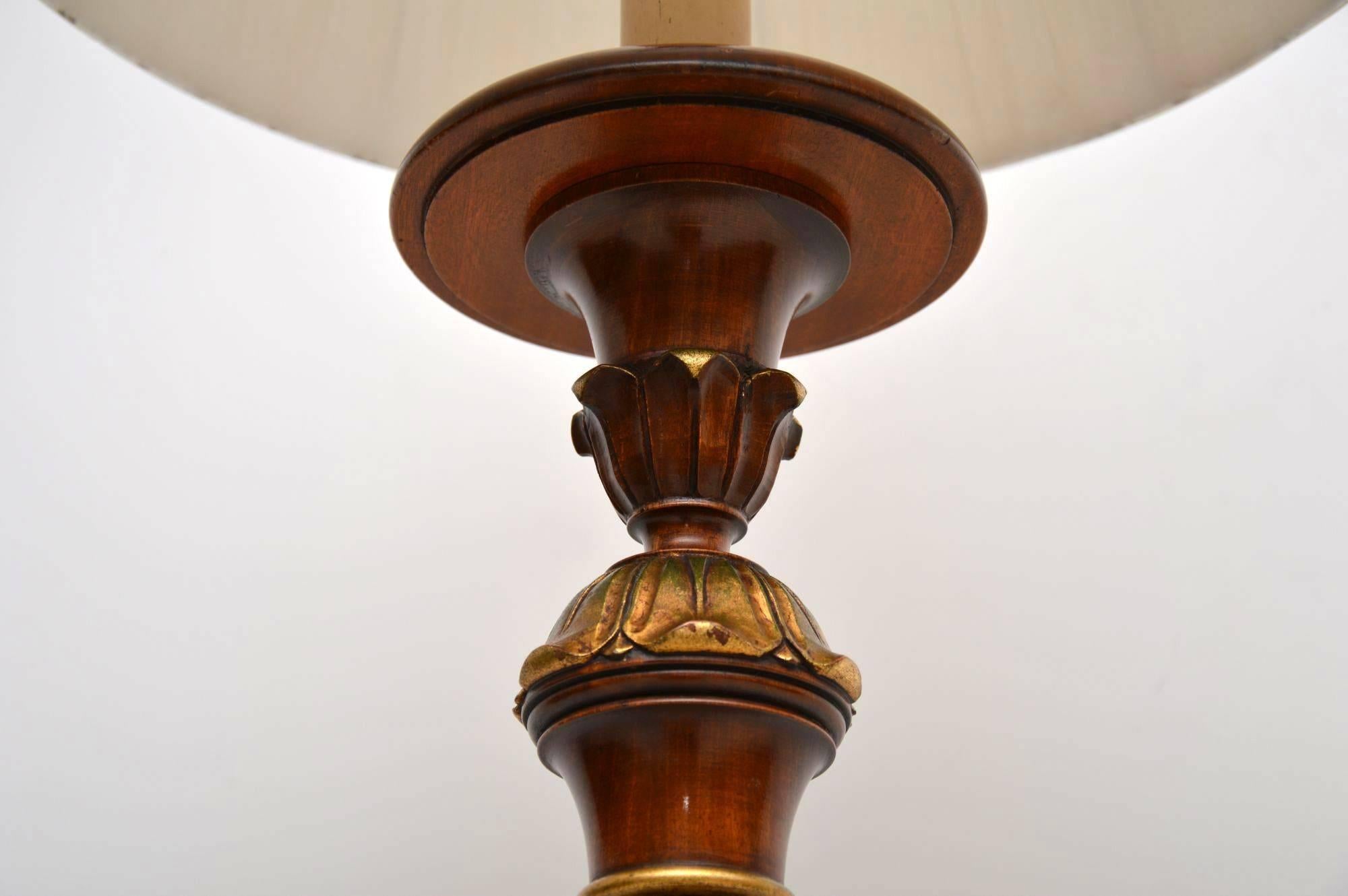 Antique walnut lamp stand with plenty of turnings and lots of gilded decorations. It's in excellent condition and has just been re-wired. It came with the lampshade, so please say if you want it or not. I would date this lamp stand to around the