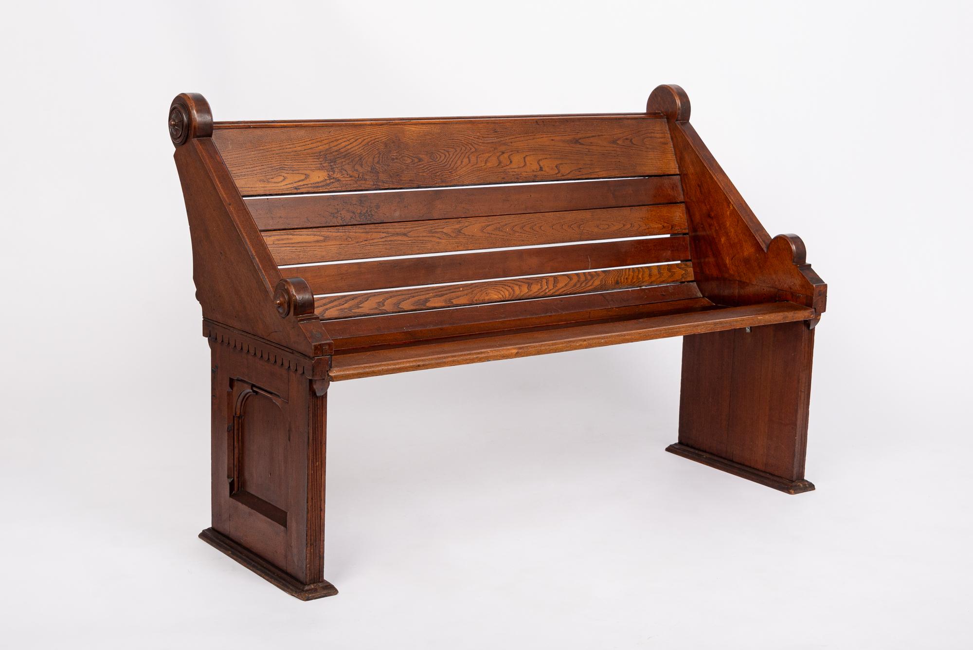 This exceptional antique Aesthetic Movement wooden church bench is circa 1870, possibly originating from Virginia. This lovely bench is handcrafted from solid oak and walnut wood with elegant design detailing indicative of the Aesthetic Movement in