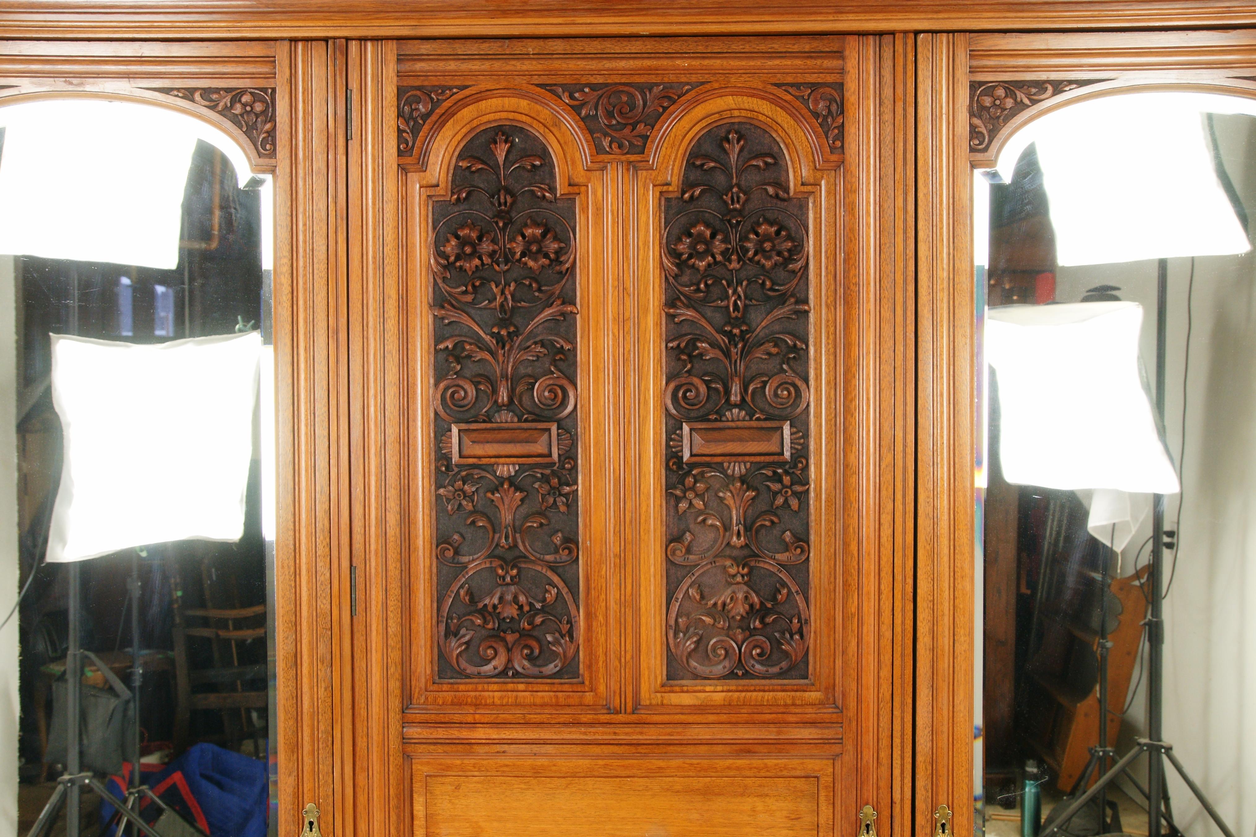 Antique walnut armoire, carved 3-door compaction closed wardrobe, Antique Furniture, Scotland 1880, B1719

Scotland 1880
Solid walnut
Original finish
Dentil cornice above
Central door with carved panel
Three raised panels below
Door opens to