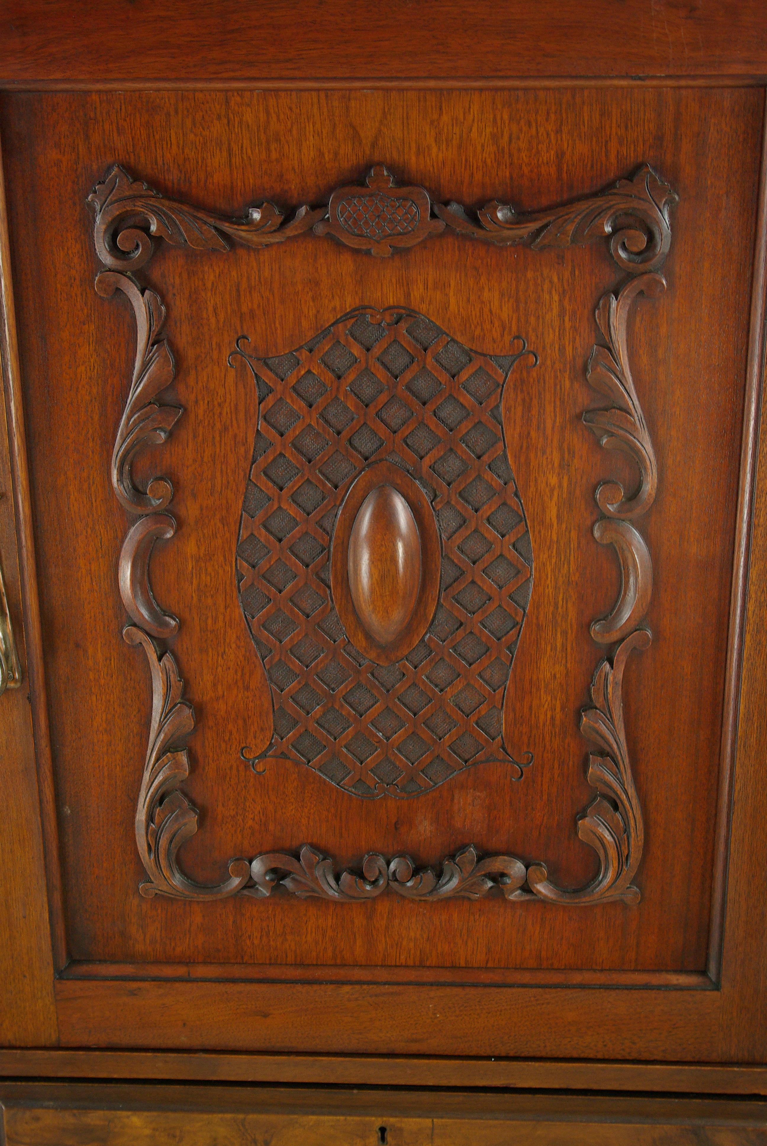 Antique walnut armoire, walnut wardrobe, chest of drawers, Scotland, 1900, Antique Furniture, B960.

Scotland, 1900.
Solid walnut and veneers
Original finish
Dentil cornice with carved shaped top
Central carved cupboard doors with storage