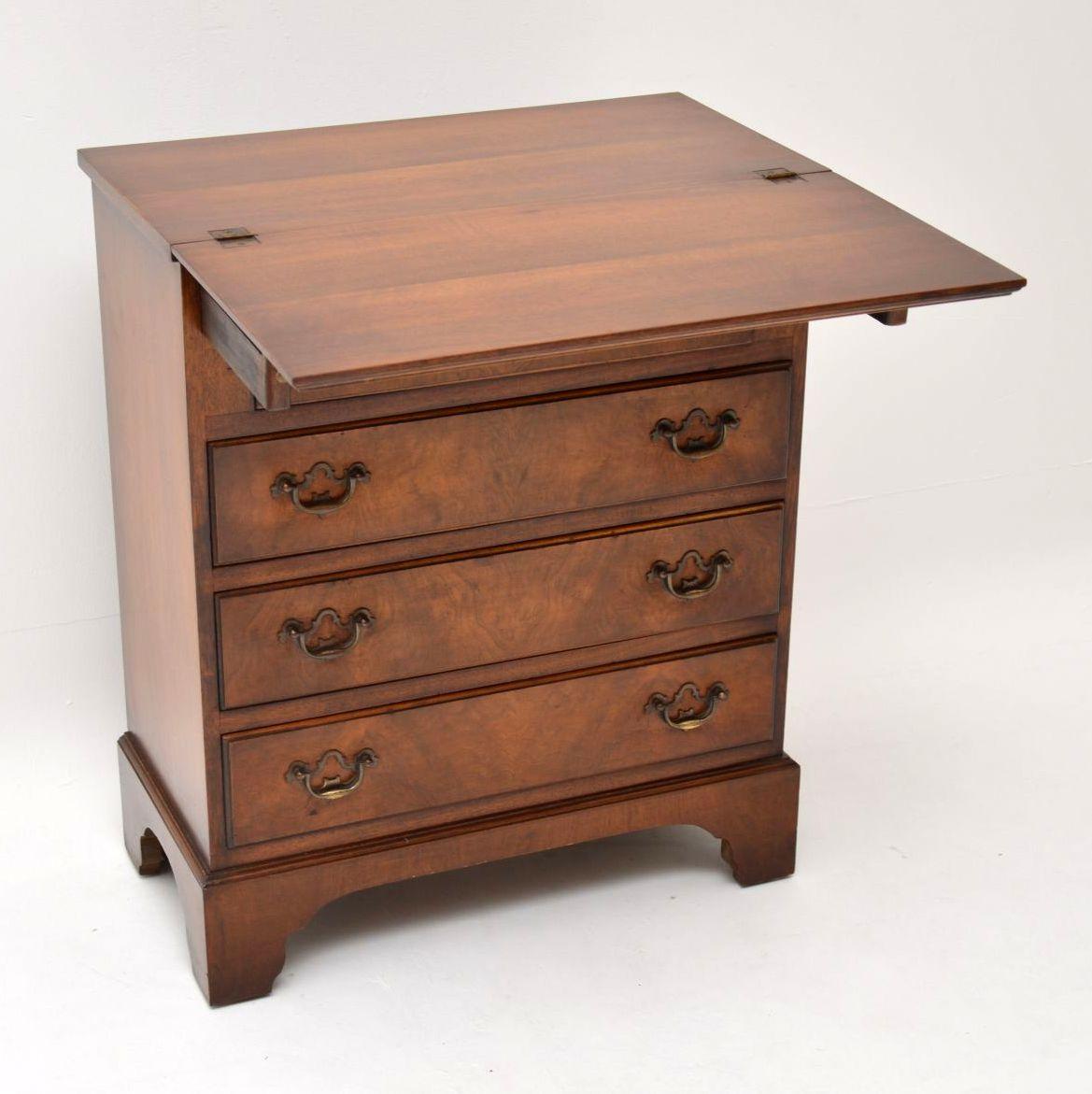 Small antique walnut bachelors chest of drawers in excellent original condition and with plenty of character. The top and drawer fronts are burr walnut while the sides are figured walnut. It has a very useful pull over top, which when opened