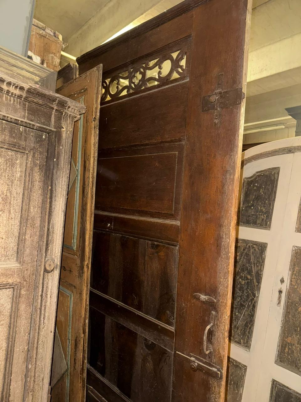 Walnut entrance door with three doors, carved panels and central knocker, italy 7