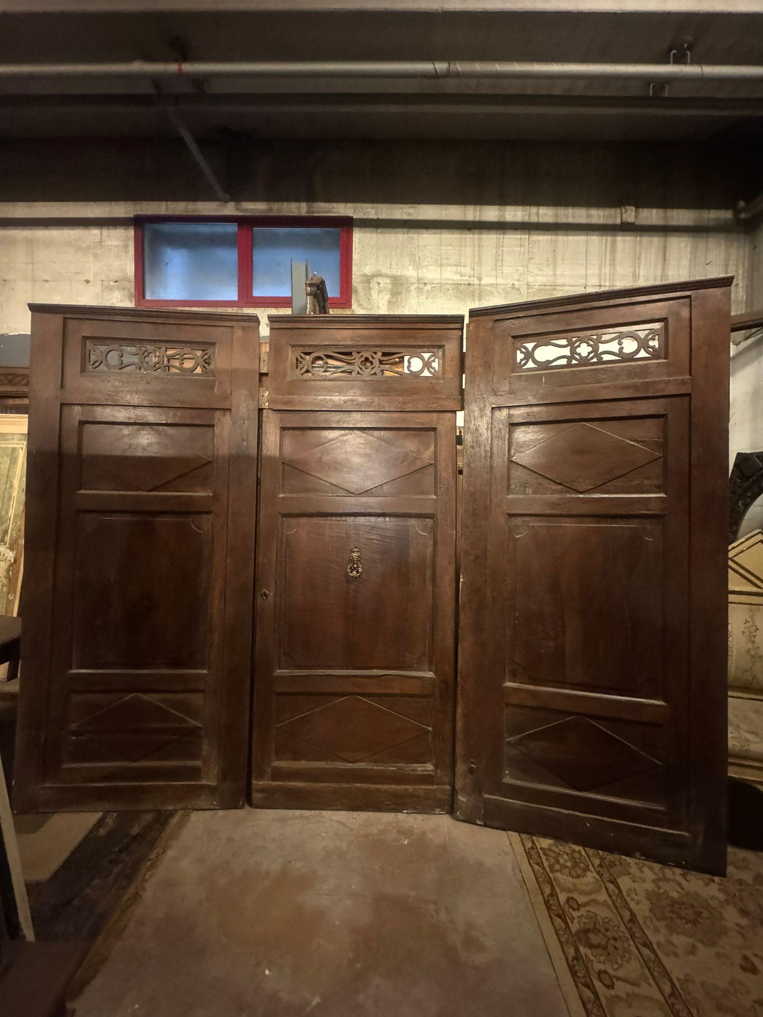 Walnut entrance door with three doors, carved panels and central knocker, italy 8