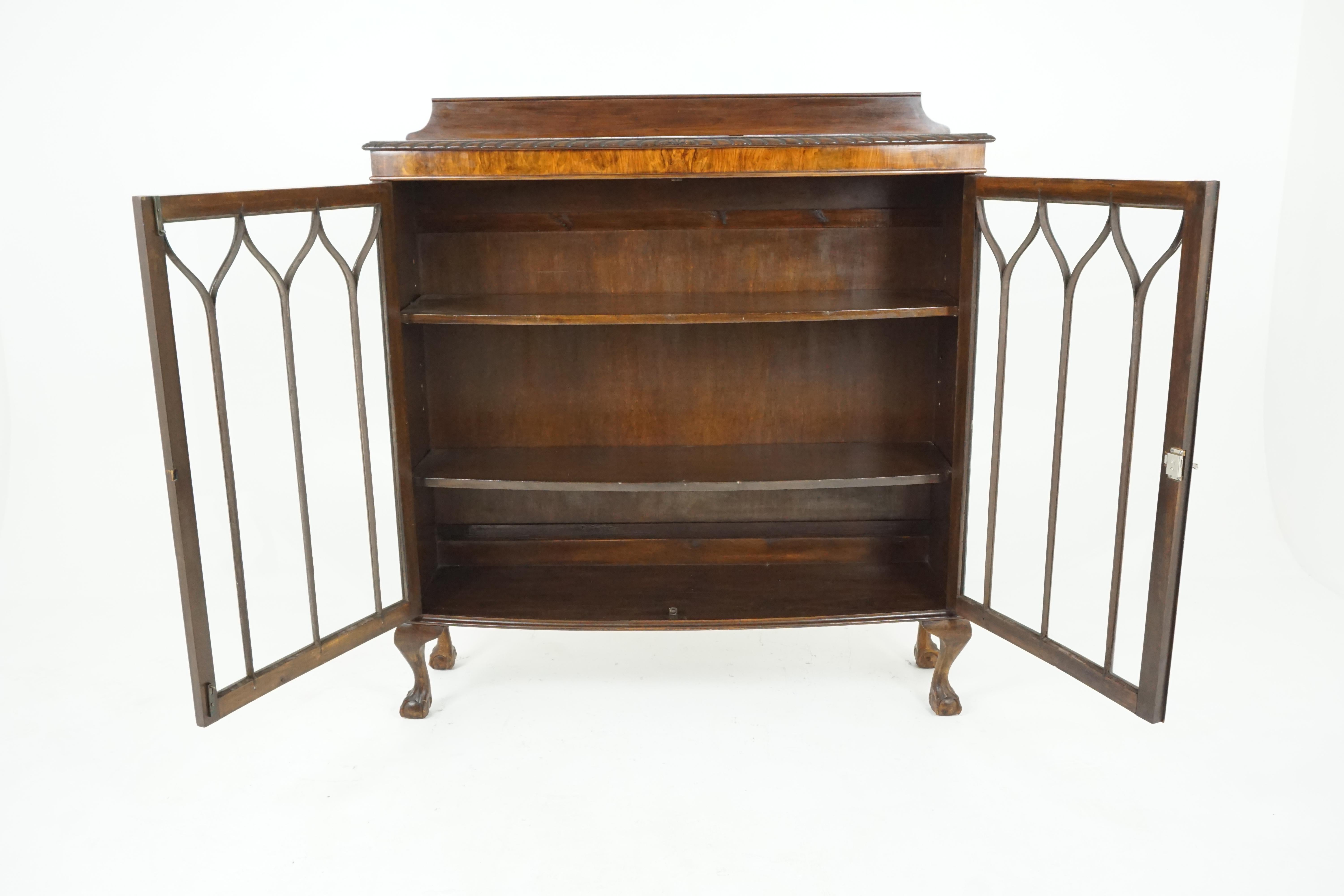 Antique walnut bookcase, bow front display cabinet or china cabinet, antique furniture, Scotland, 1920

Scotland. 1920
Solid walnut and veneer
Original finish
Raised back
Bow front top with pie crust edge
Pair of original glass doors with