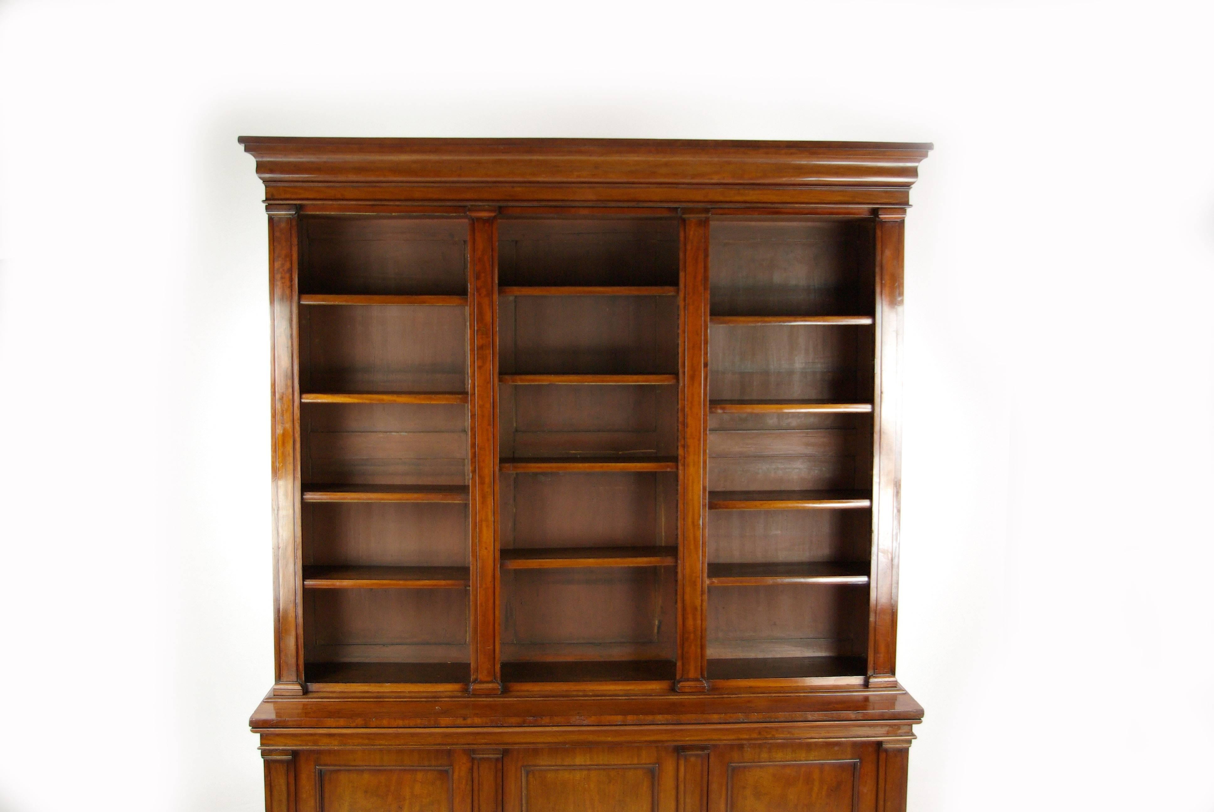 Scotland, 1860
Solid Walnut and veneers
Simple stylish cornice above
Three open sections with 12 adjustable mahogany shelves
Beneath top section are three paneled doors with interior shelves behind
Standing on an enclosed plinth base
Lovely quality