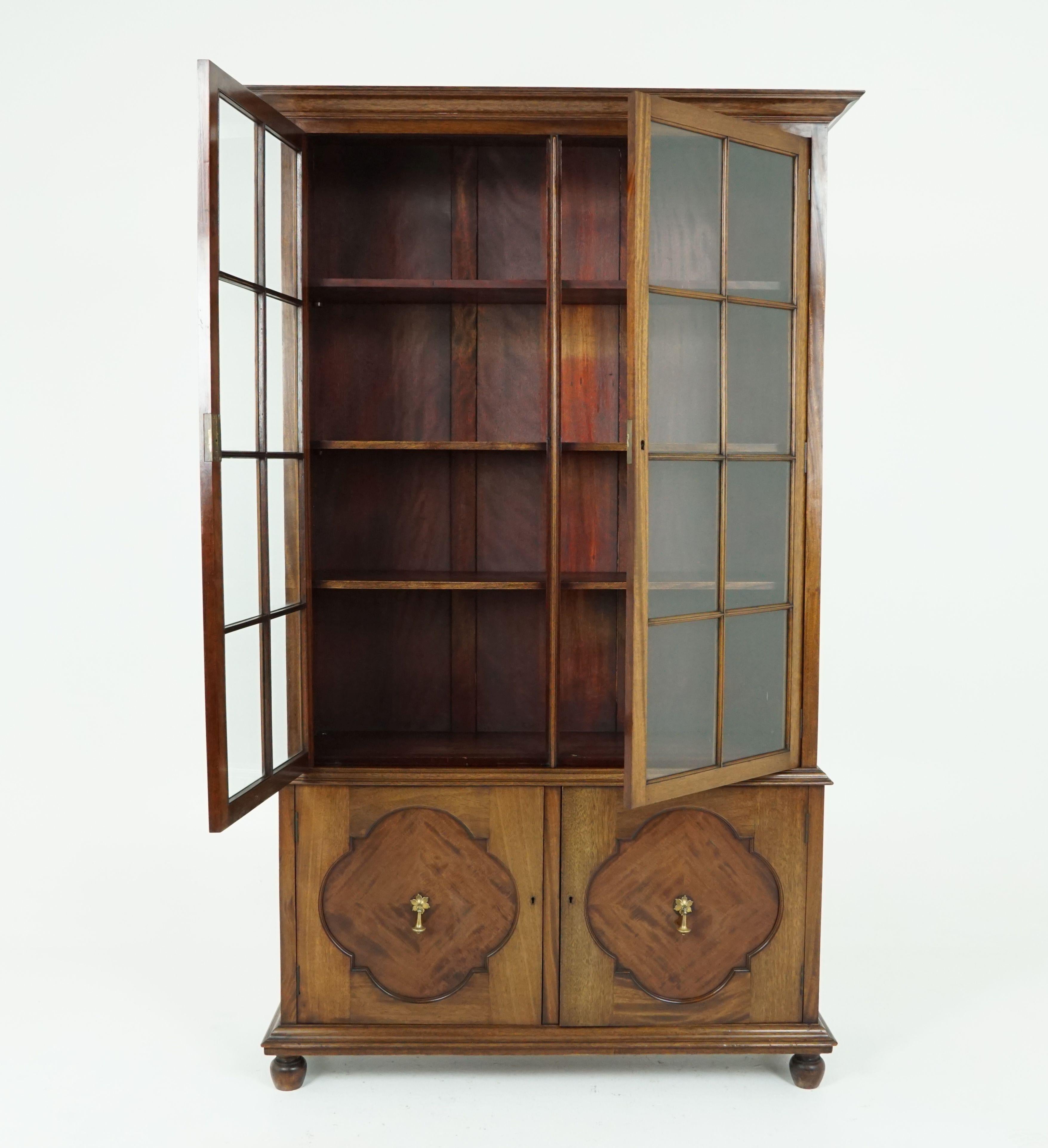 Antique walnut bookcase, tall 4-door display cabinet by A. Gardner & Son in Glasgow, Antique Furniture, Scotland 1910, B1861

Scotland, 1910
Solid walnut and veneer
Original finish
Flared out shaped cornice above
Pair of rectangular doors