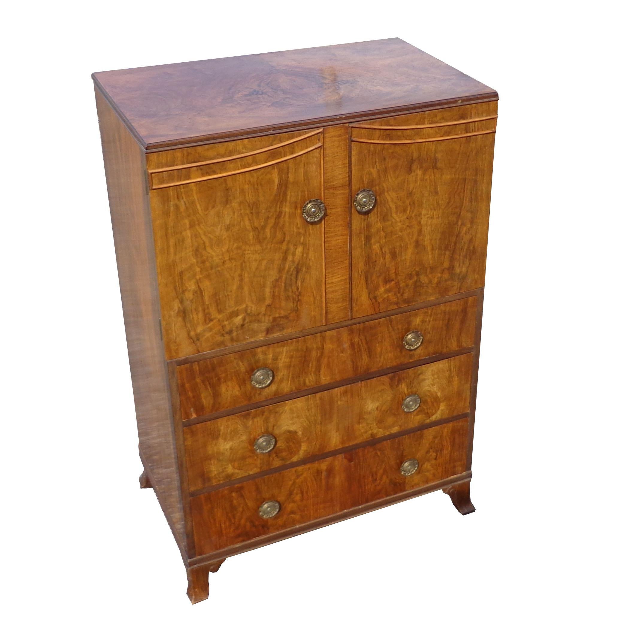Antique walnut burl dresser armoire linen cabinet

Rich walnut with 2 door shelves and 3 drawers beneath.
Original brass pulls.

 