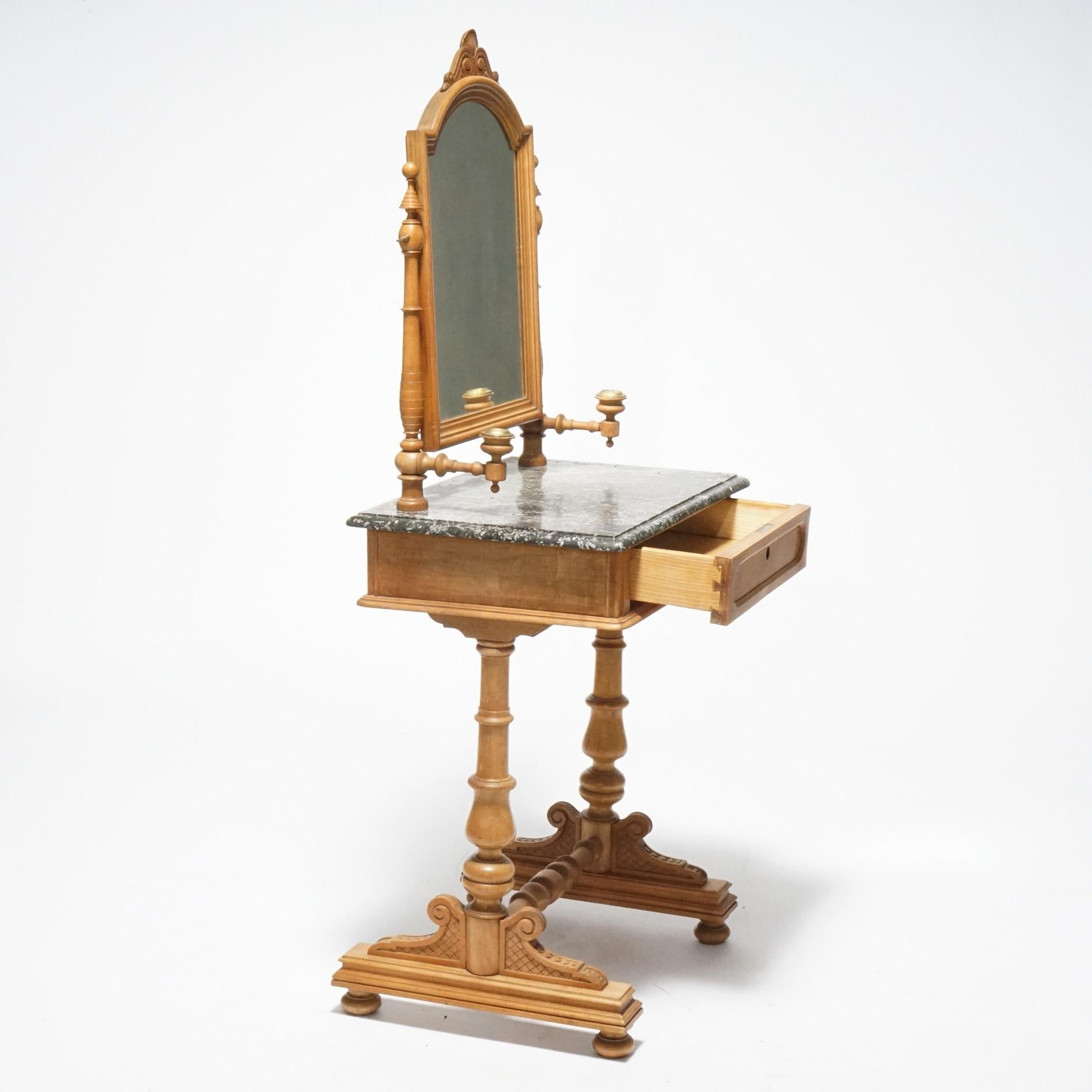 An antique dressing table offers walnut and burl construction with arch form mirror having scroll and shell carved crest over marble top stand with single drawer, raised on trestle base having turned legs, c1890

Measures- 56.75''H x 26.25''W x