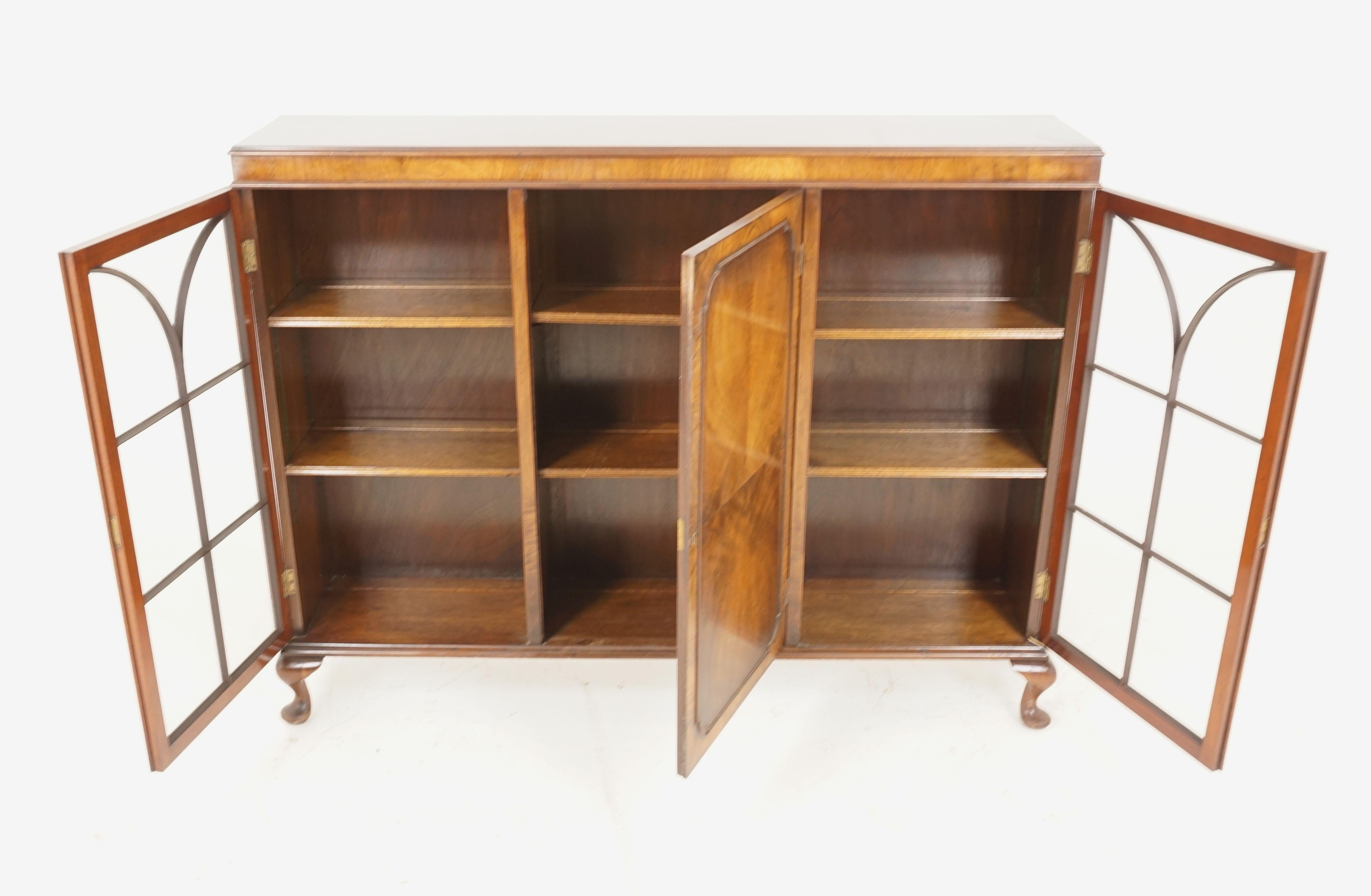 Antique walnut cabinet, three door display cabinet, bookshelf, Scotland 1920, B1923

Scotland 1920
Solid walnut and veneer
Original finish
Rectangular molded top
Central paneled door below with a pair of adjustable shelves
Flanked by a pair