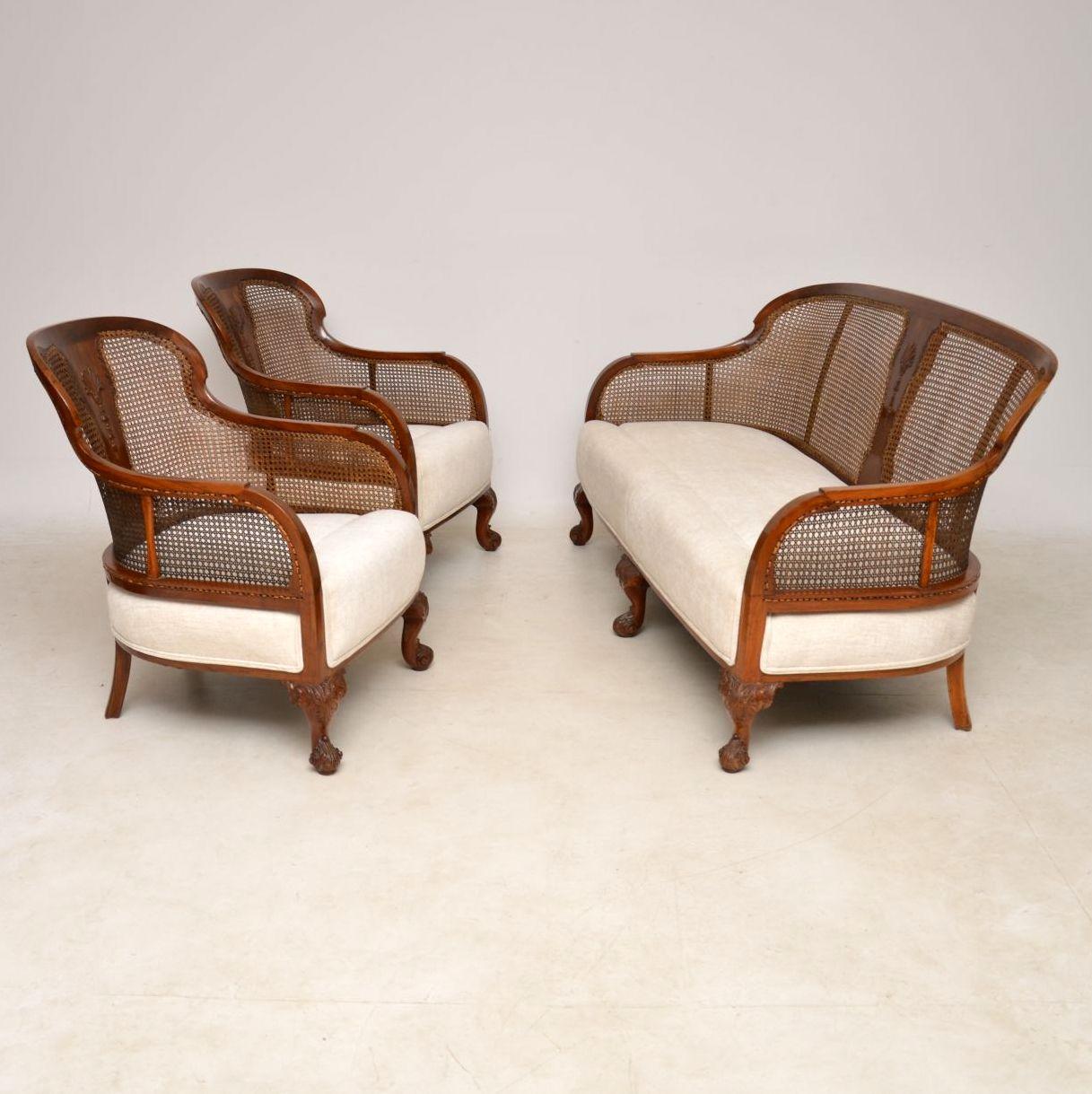 Antique Bergere three-piece lounge suite, consisting of a sofa and two armchairs. The frames are solid walnut with cane panels. It's all been polished and re-upholstered, so is in excellent condition. We have only had the seats re-upholstered, but